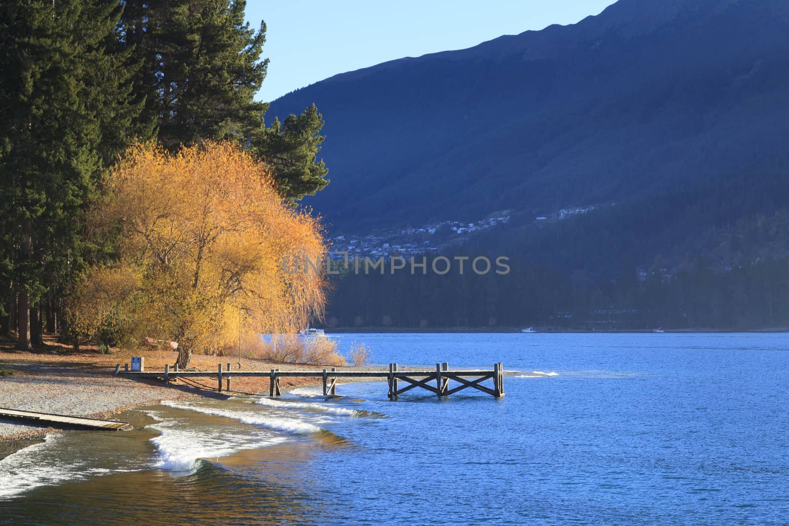 Beautiful scenic of Lake Wakatipu with small jetty, Queenstown, Otago region, South Island, New Zealand.