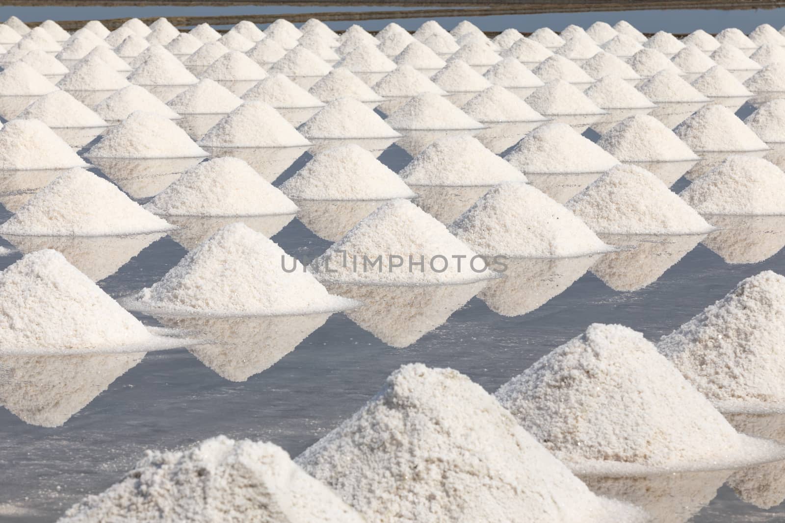 Heap of sea salt in salt farm ready for harvest,  Thailand.