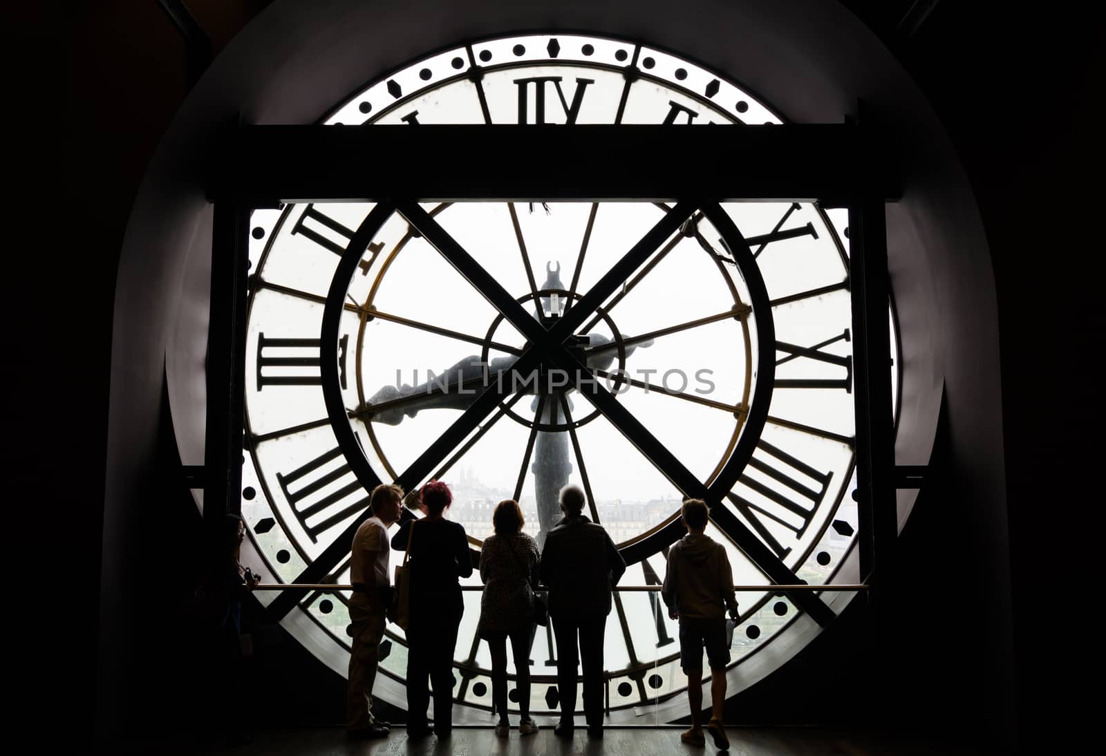 Paris, France - May 14, 2015: Silhouettes of unidentified tourists in the museum D'Orsay. by siraanamwong