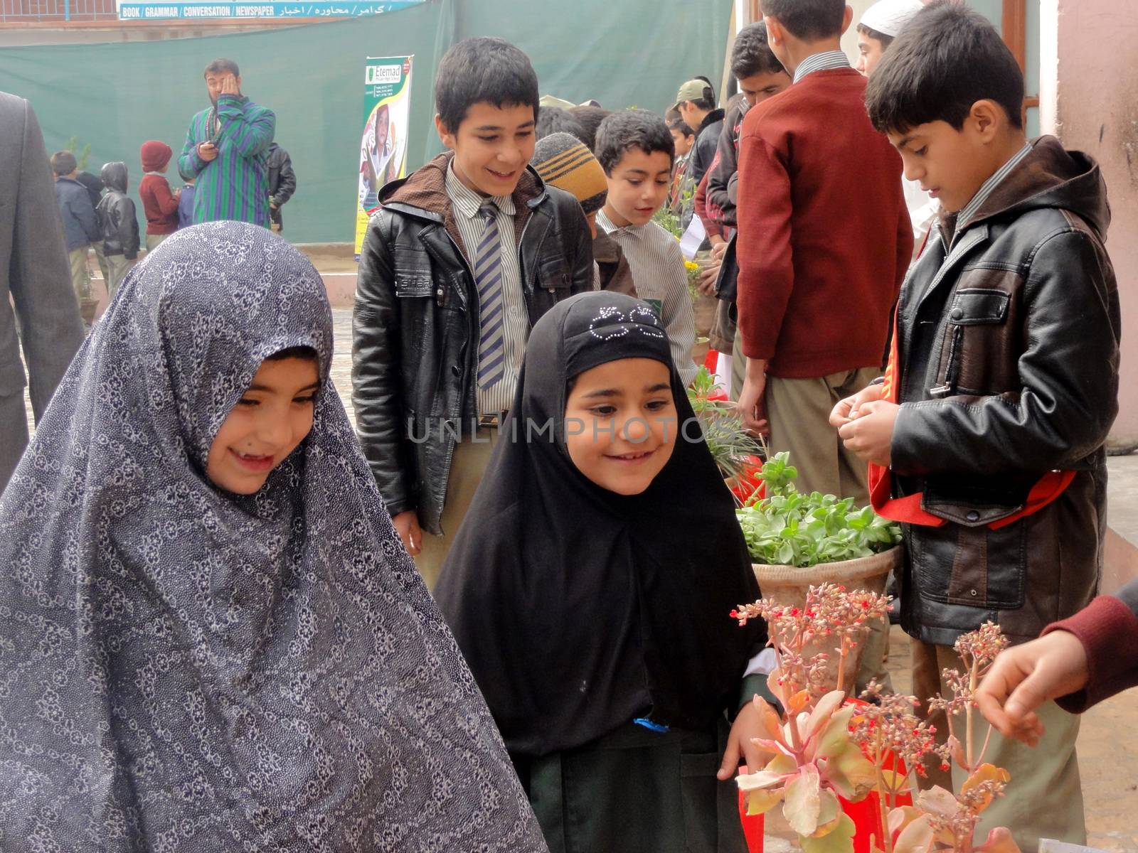 AFGHANISTAN, Kandahar: Tens of thousands of children in Kandahar don't attend school, due to a shortage of teachers and school buildings, the cost of schooling, and the cultural beliefs around education for girls. These photos capture children not in school who play on the streets or care for siblings, as well as some of the lucky ones who are being educated. Pictures taken on September 11, 2015. All children have parental permission to be photographed. 