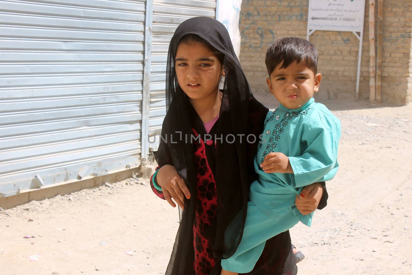 AFGHANISTAN, Kandahar: Tens of thousands of children in Kandahar don't attend school, due to a shortage of teachers and school buildings, the cost of schooling, and the cultural beliefs around education for girls. These photos capture children not in school who play on the streets or care for siblings, as well as some of the lucky ones who are being educated. Pictures taken on September 11, 2015. All children have parental permission to be photographed. 