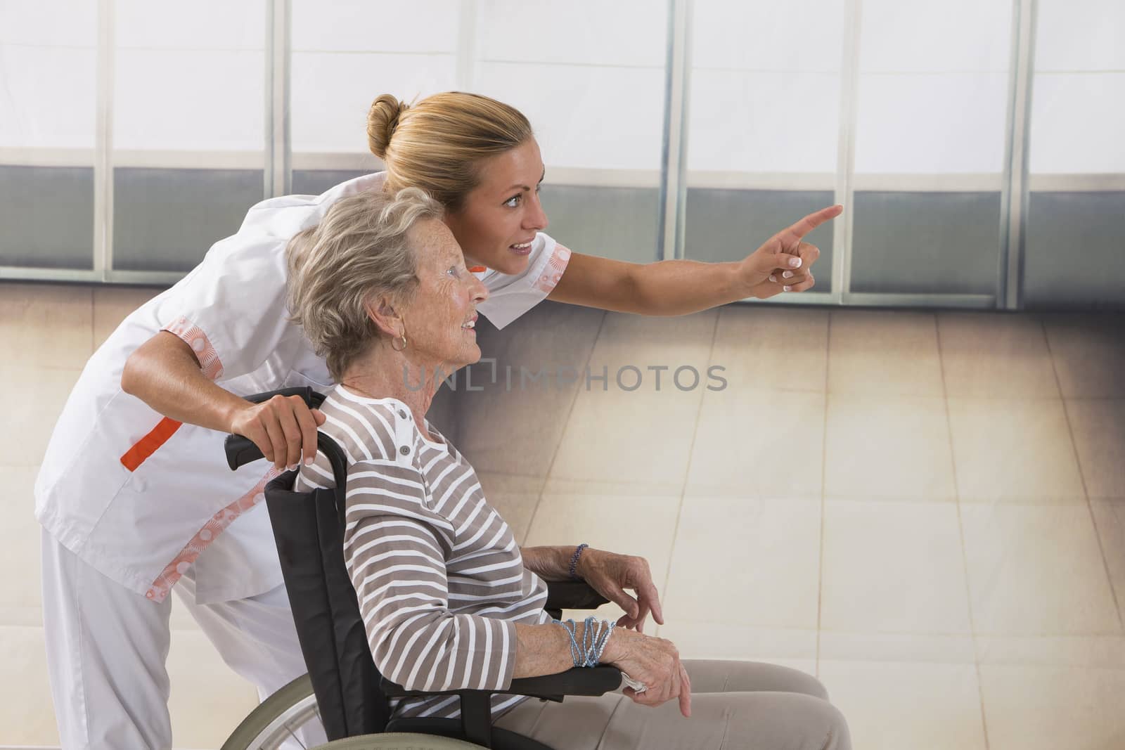 Elderly lady on wheelchair and her care giver   by JPC-PROD