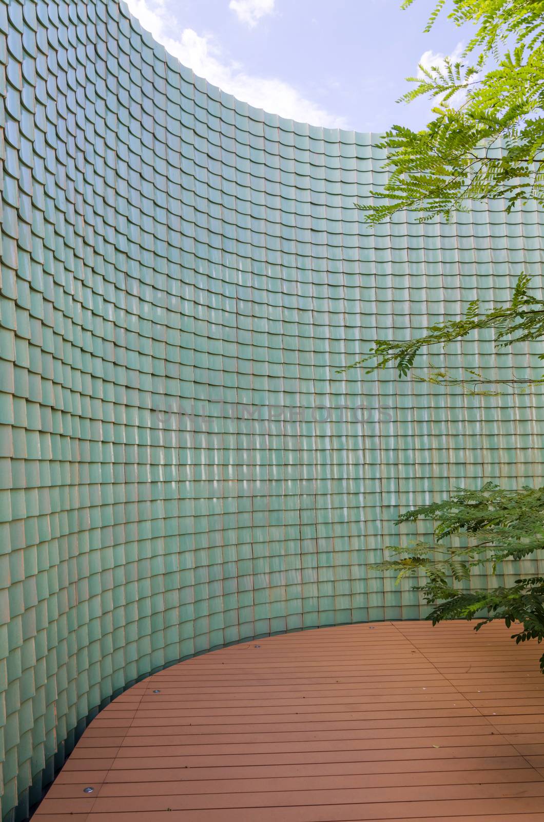 Chinese green glazed tile wall in the garden by siraanamwong
