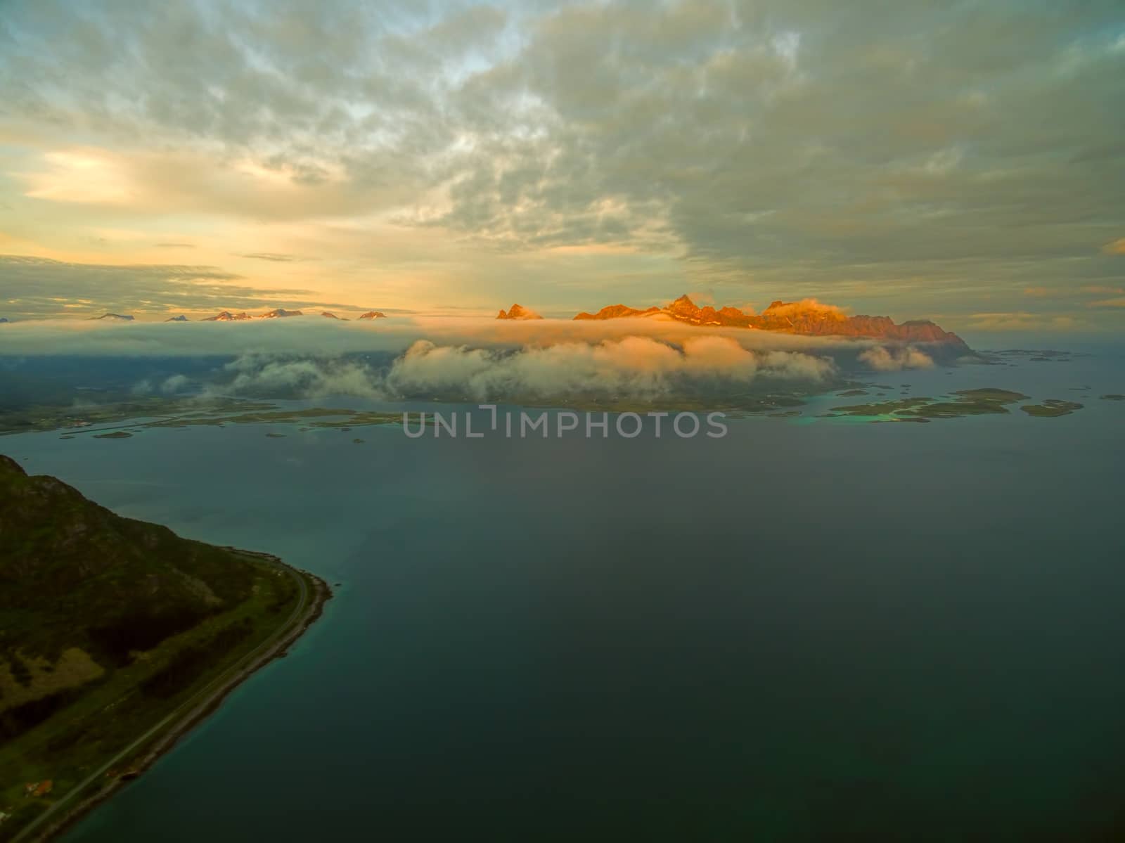 Magnificent peaks on Lofoten islands in Norway lit by midnight sun