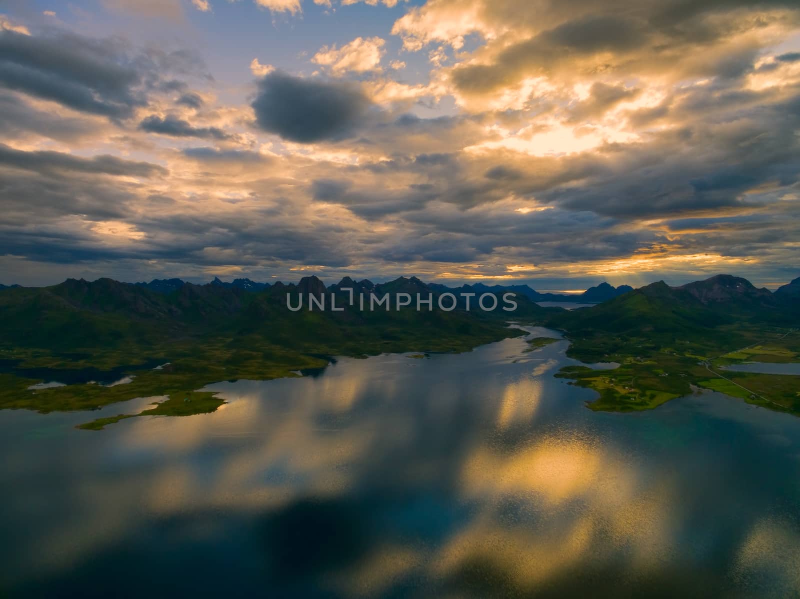 Breathtaking view of reflecting clouds on Vesteralen islands with their dramatic mountain peaks