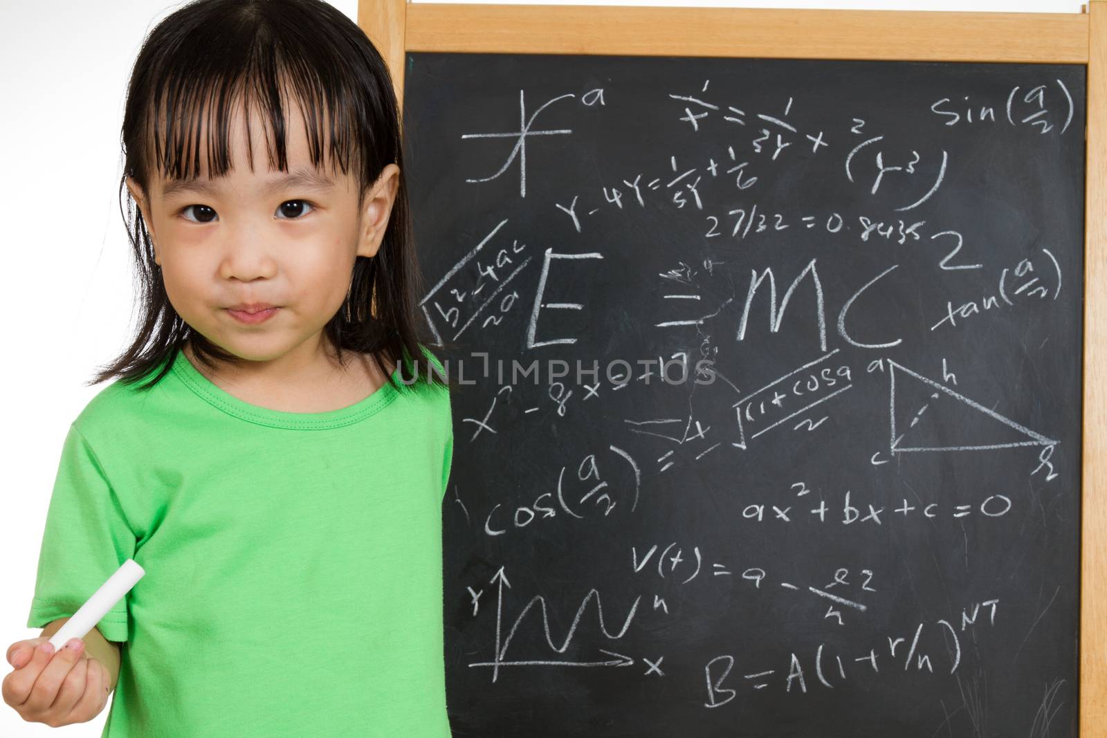 Asian Chinese children againts blackboard or chalkboard with formulas in plain isolated white background.