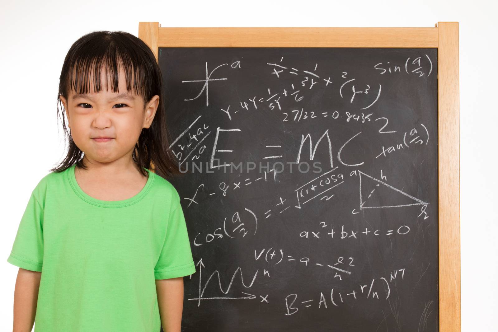 Asian Chinese children againts blackboard or chalkboard with formulas in plain isolated white background.