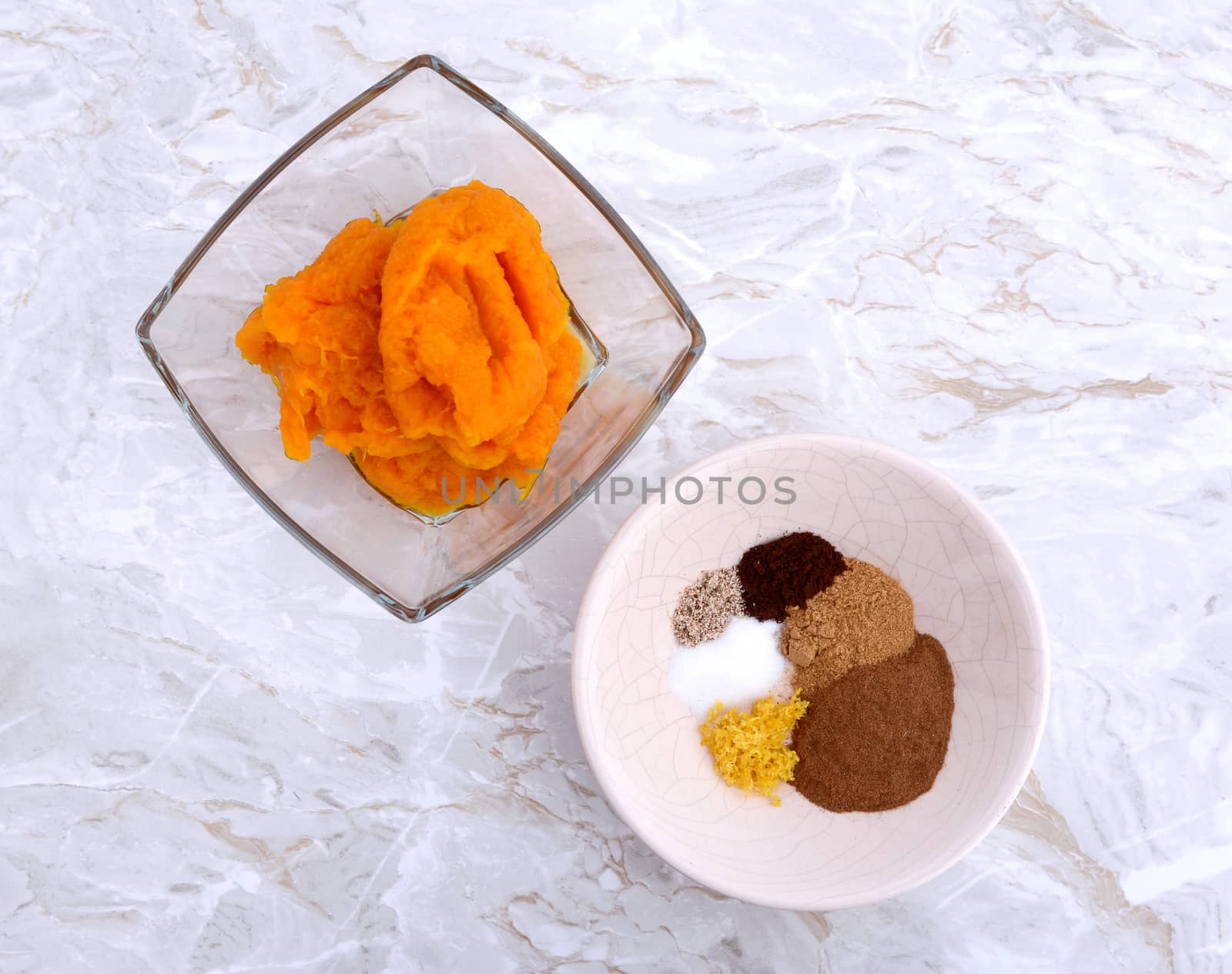 Pumpkin puree and spices - ginger, cinnamon, nutmeg, cloves, lemon zest and salt - ingredients for pumpkin pie filling