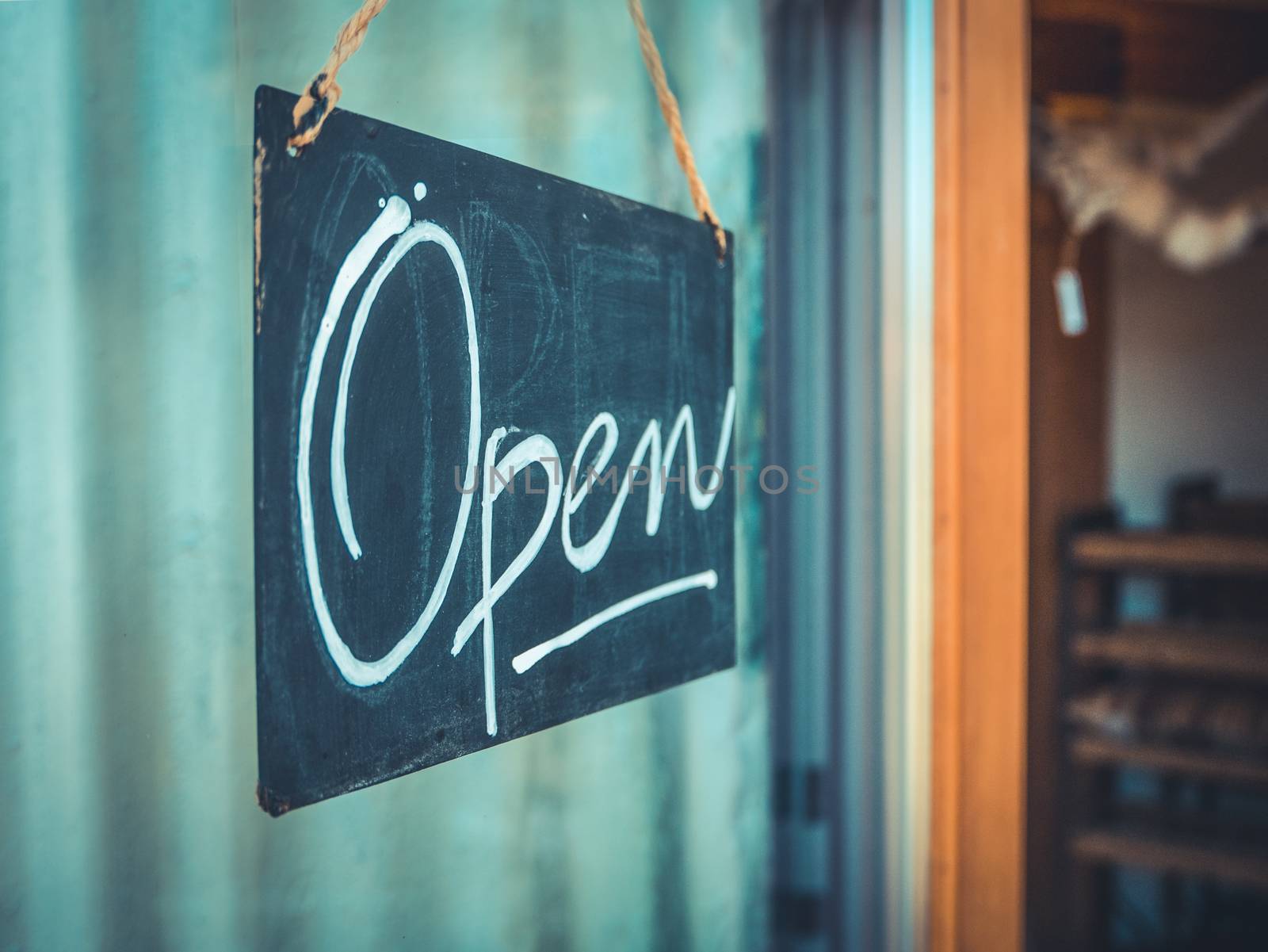 Rustic Open Sign Hanging In The Door Of A Coffee And Gift Shop In The Pacific Northwest