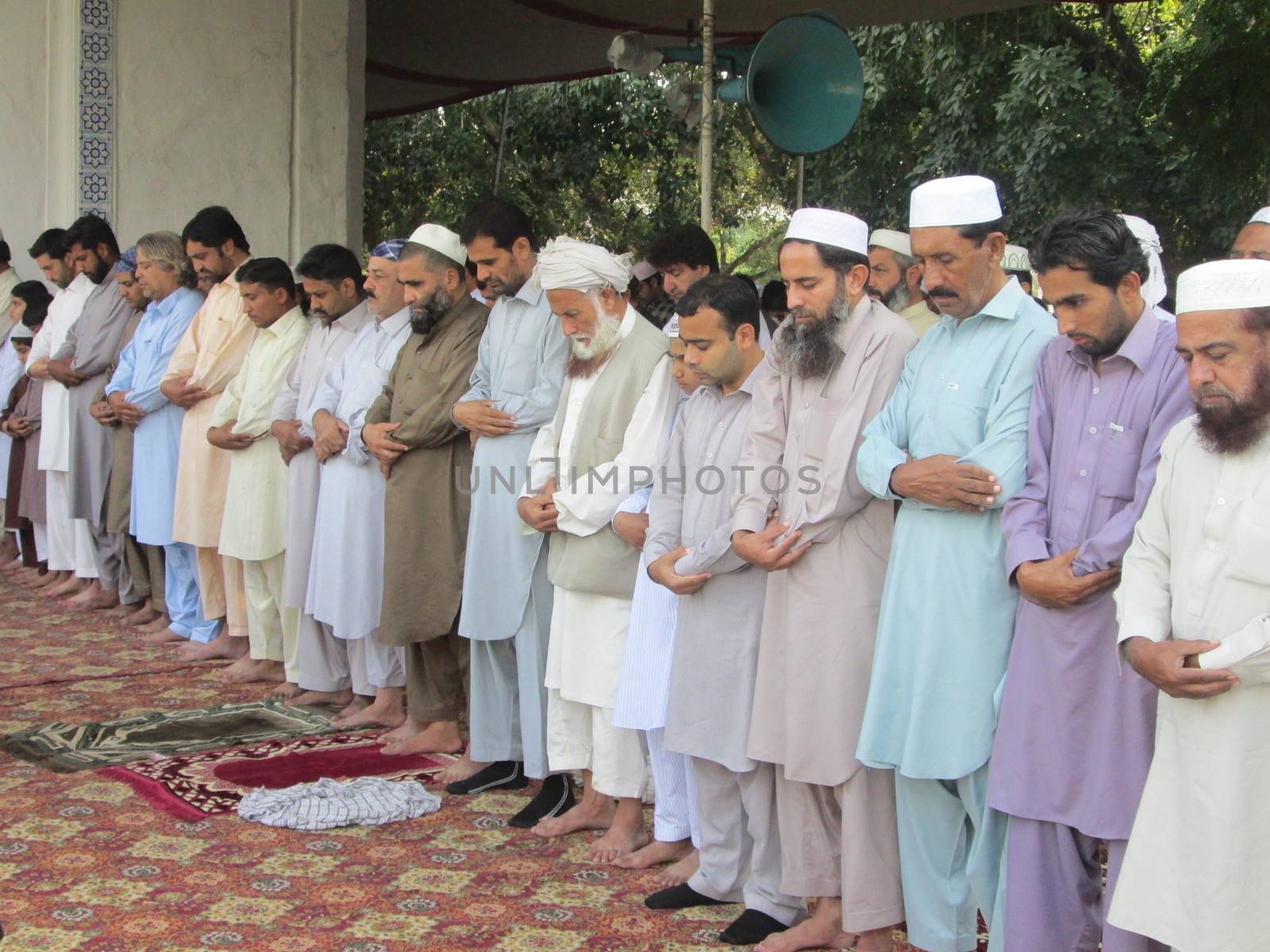 PAKISTAN, Peshawar: Muslims celebrate Eid-al-Adha by offering prayers at a mosque in Peshawar, Pakistan on September 25, 2015. The festival marks the end of Hajj, which is a holy pilgrimage that many Muslims make every year.  	