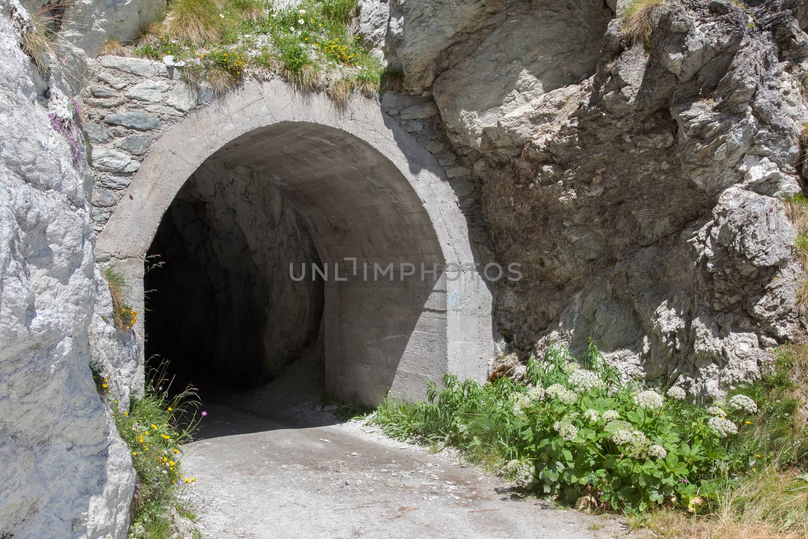 Small dark tunnel in a Swiss mountain