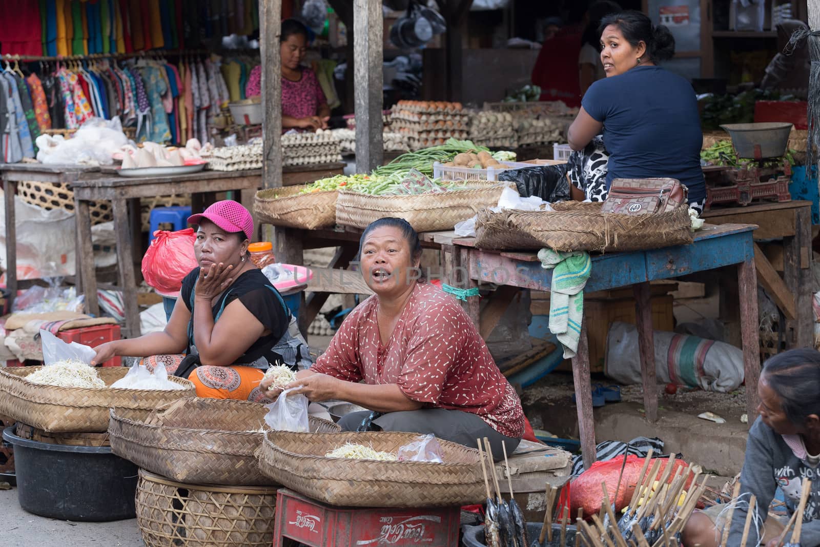 PENIDA ISLAND, INDONESIA - JUNE 30.2015: woman Hindu at the traditional daily street market, village Toyopakeh, Nusa Penida, Bali June 30. 2015 Indonesia