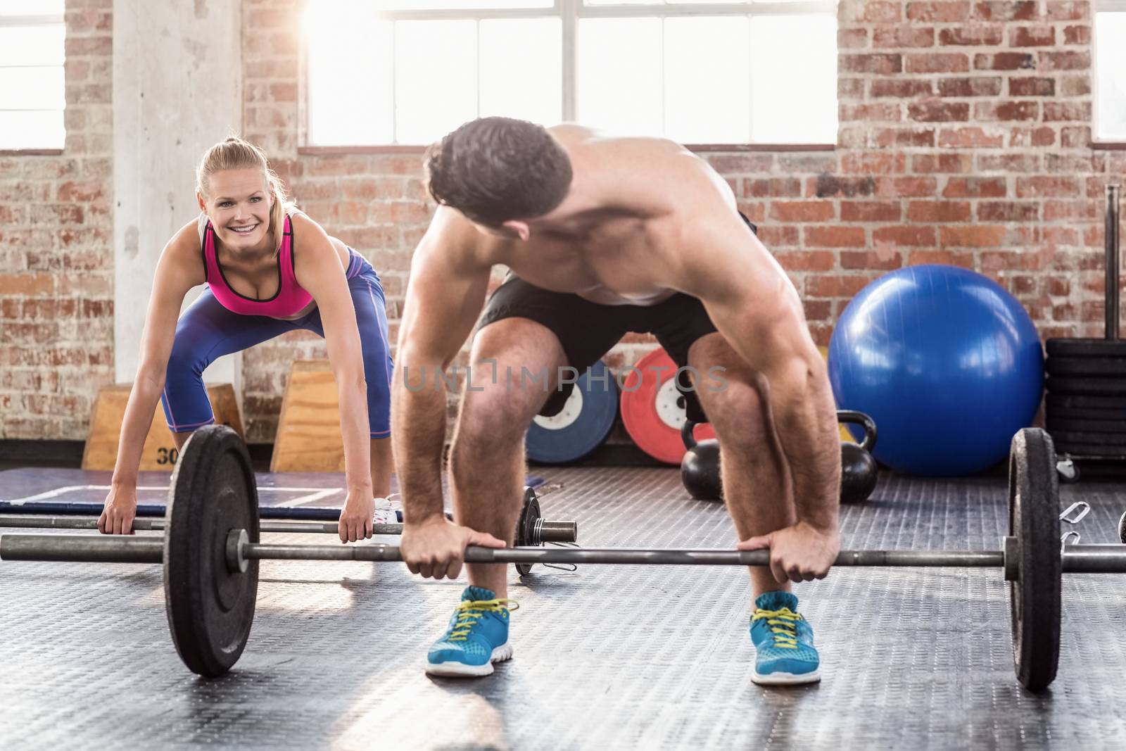 Two fit people working out by Wavebreakmedia