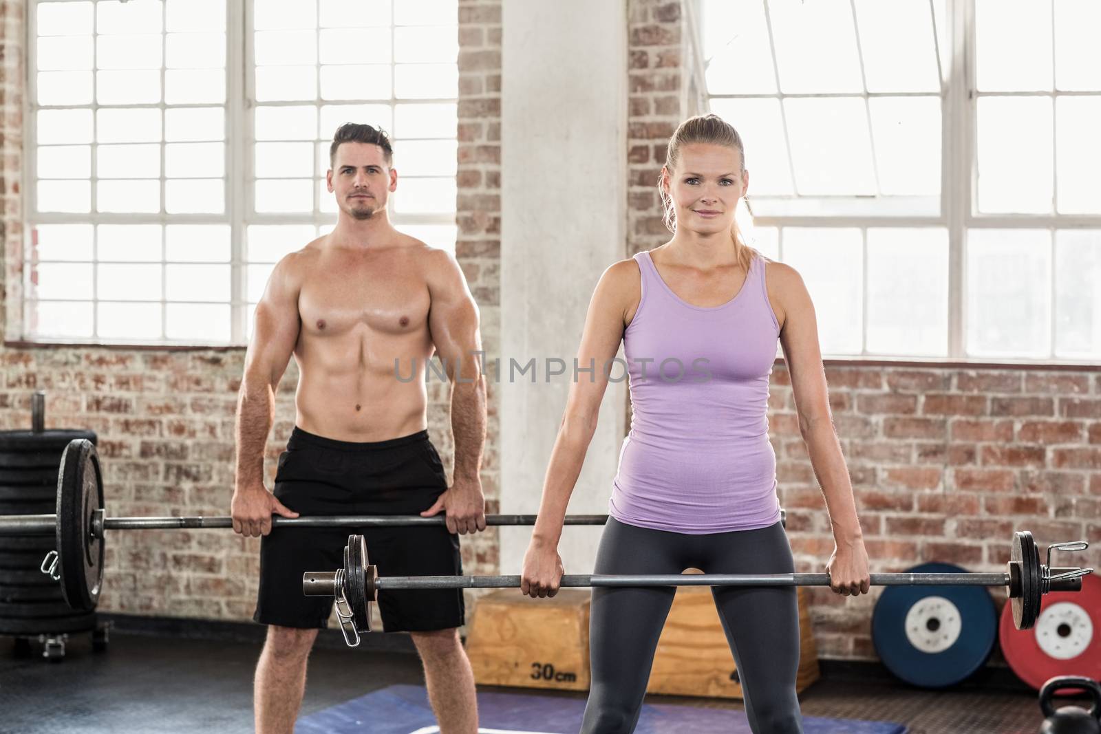Two fit people working out  by Wavebreakmedia