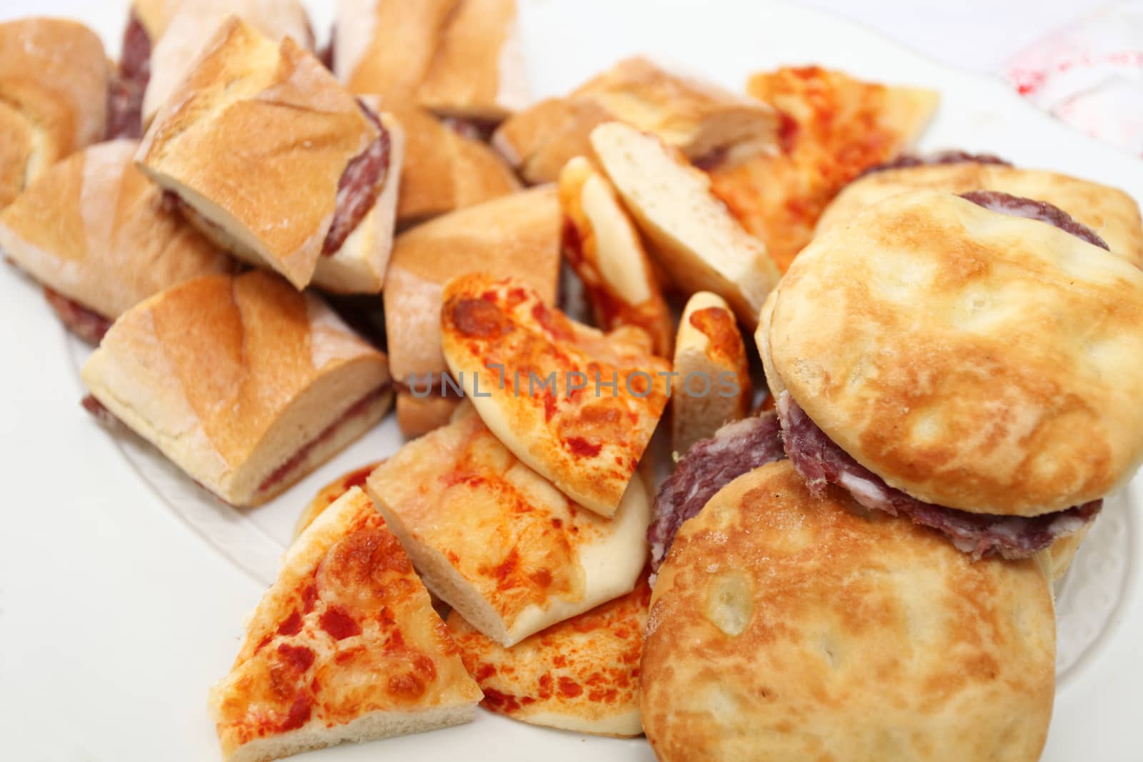 plate of sandwiches with corpses, buns and pizza