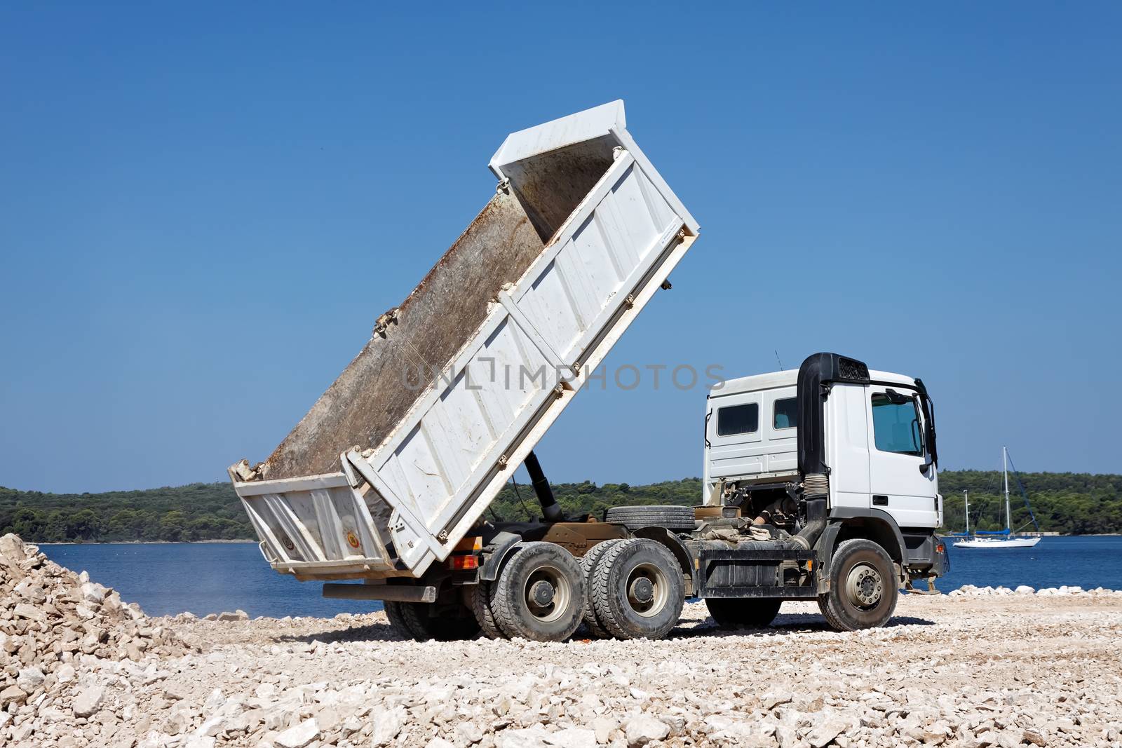 tipper truck unload crushed rocks