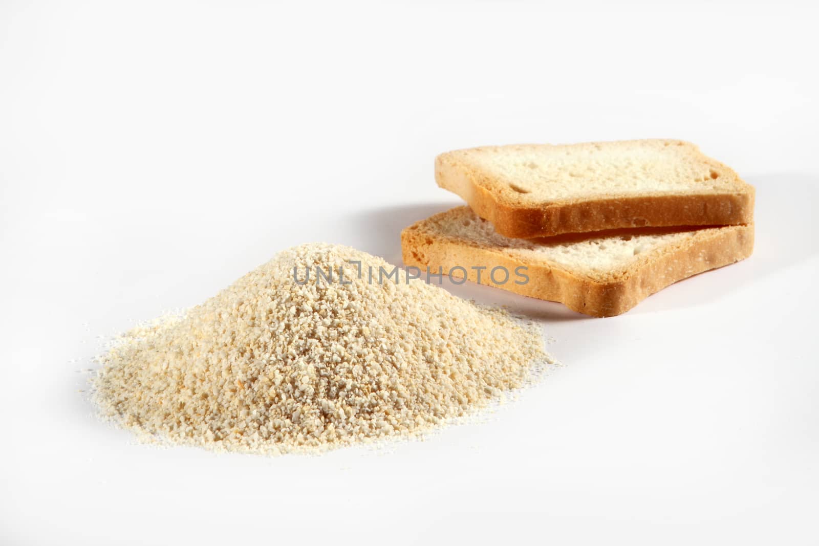 biscuits and bread crumbs on white background