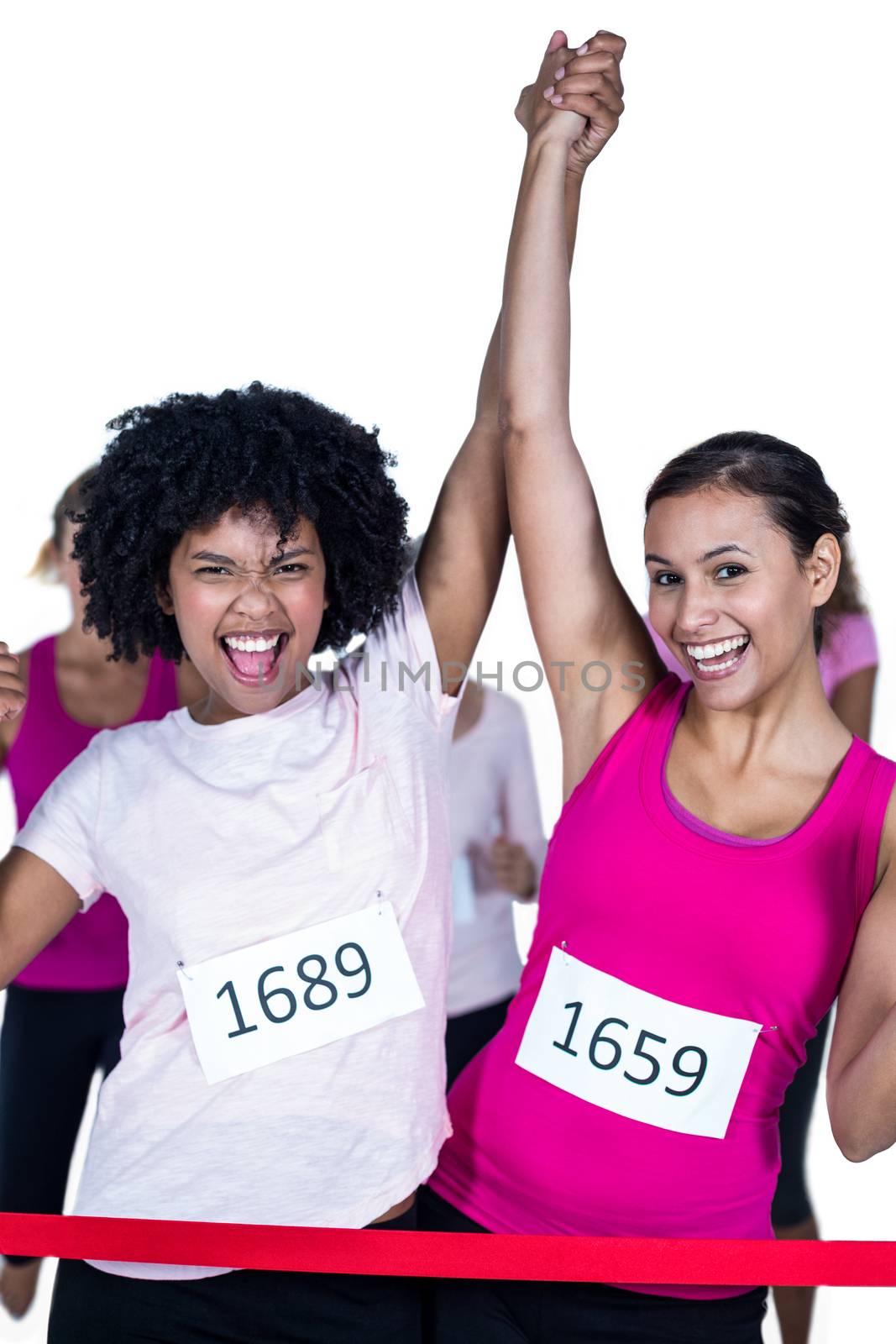 Portrait of cheerful winner athletes crossing finish line with arms raised  by Wavebreakmedia