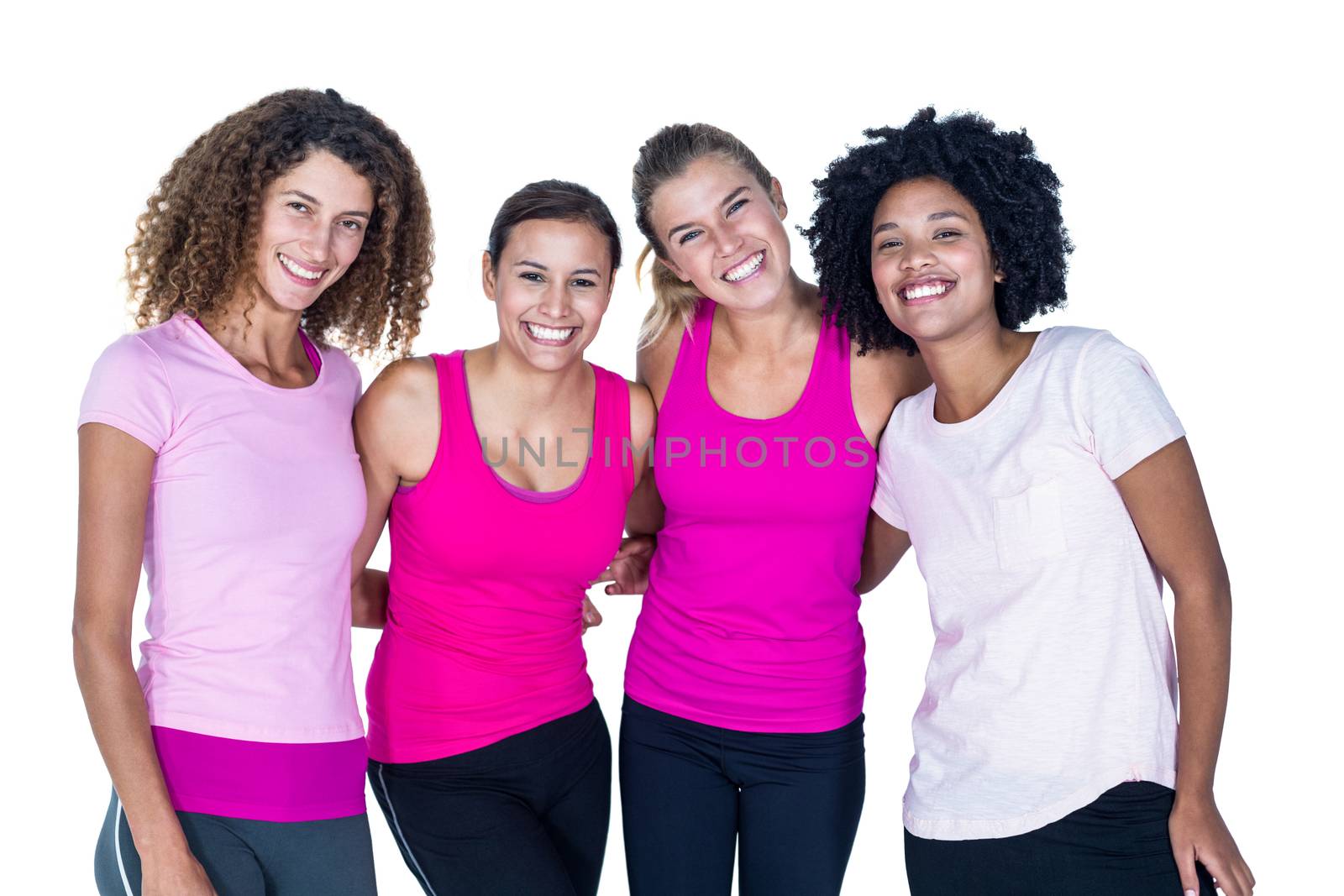 Portrait of smiling group of women with arms around while standing against white background