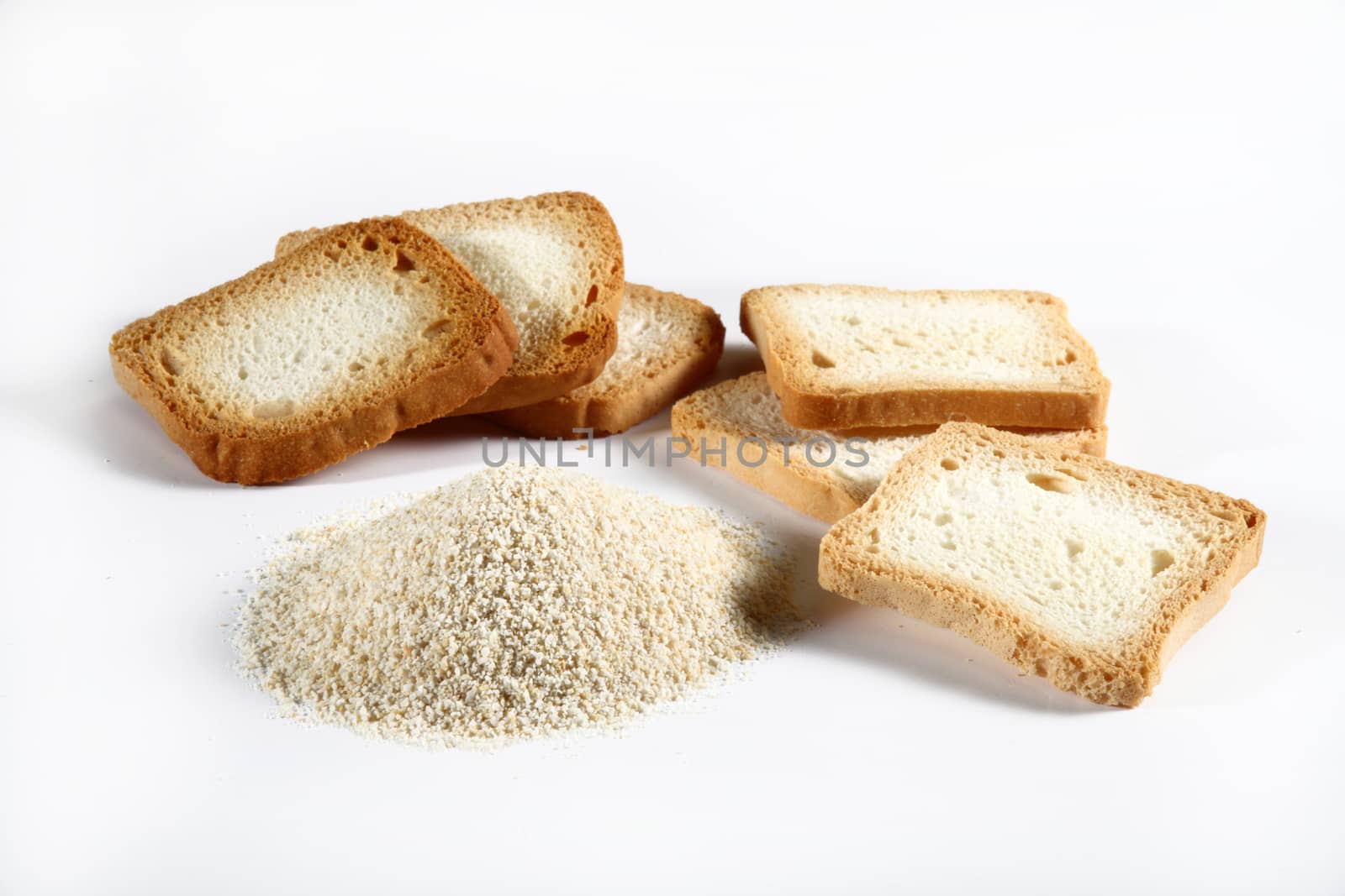 group biscuits and bread crumbs on white bacckground