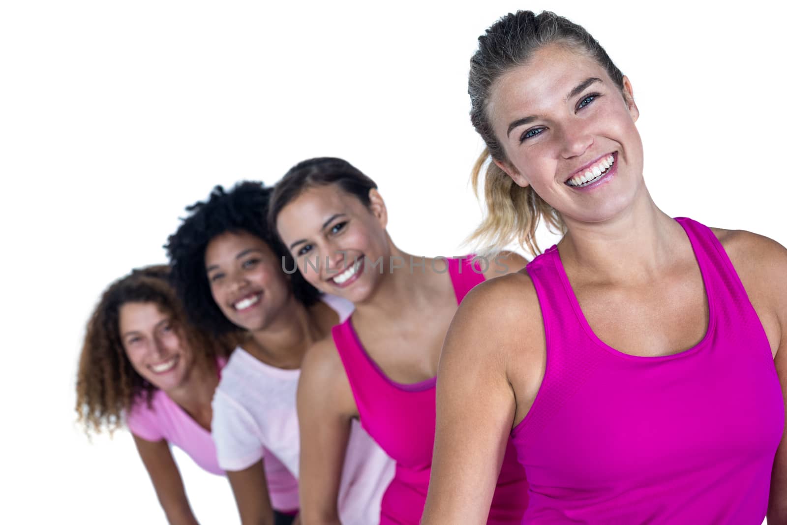 Portrait of happy women standing in row against white background
