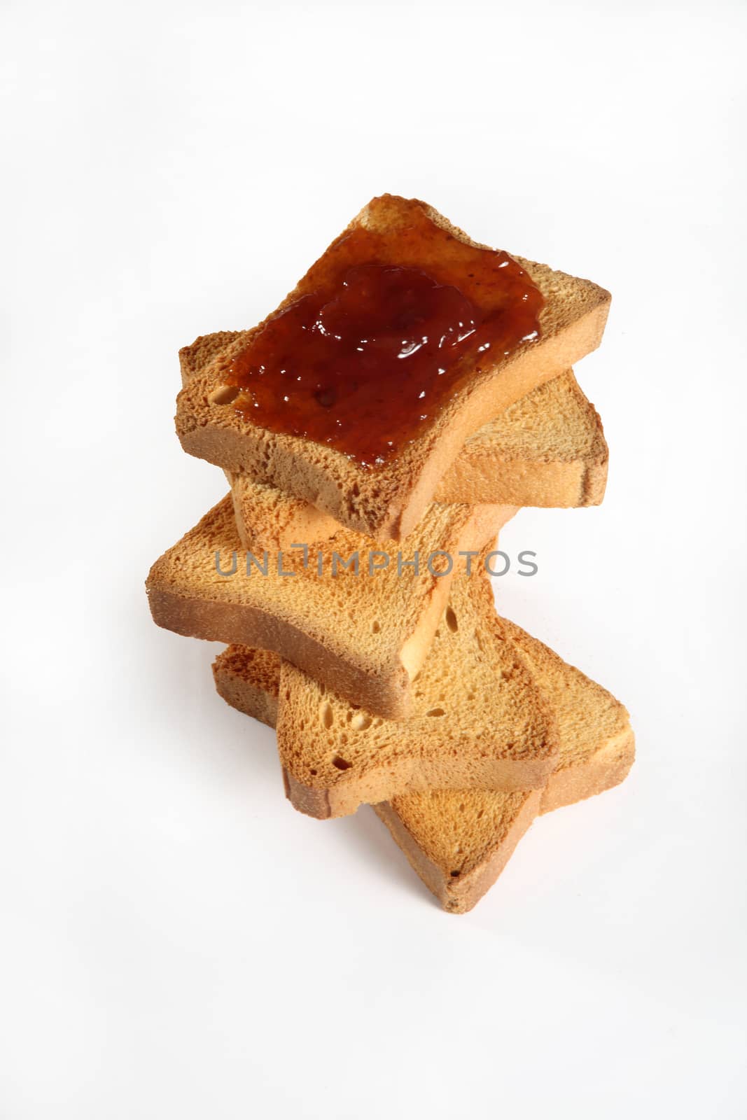 biscuits with jam viewed from above on white by diecidodici