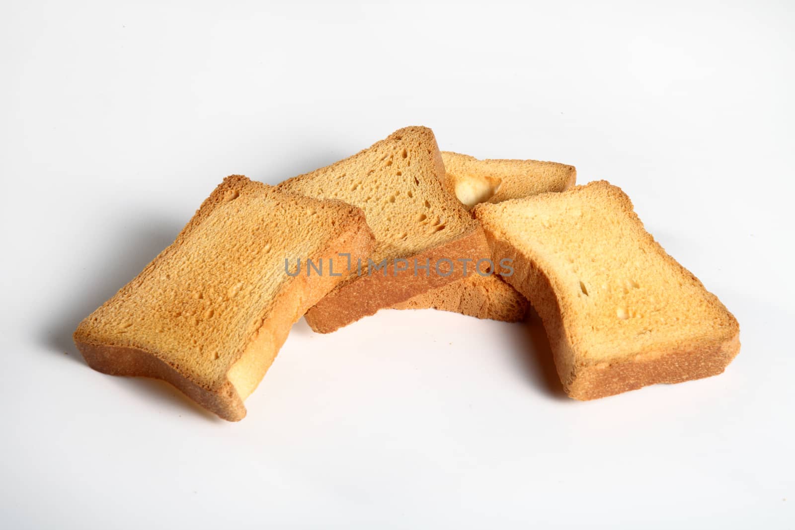 four slices toast viewed from above on a white background