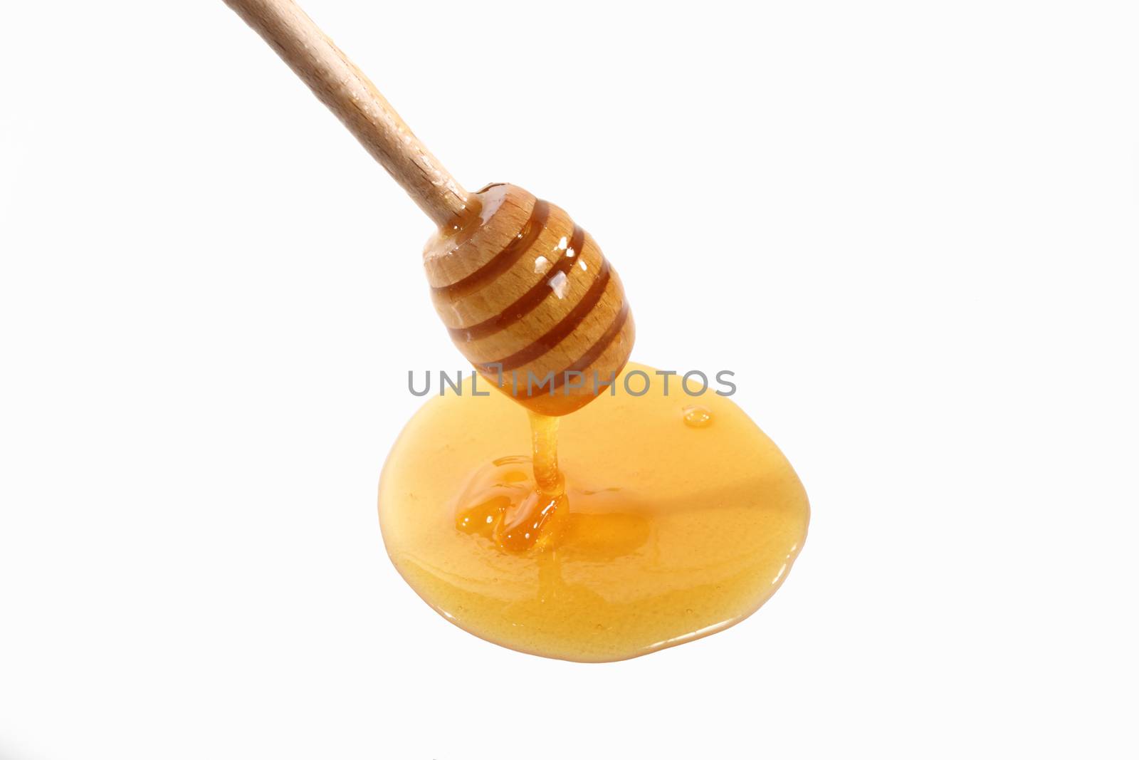 tablespoon honey on white background