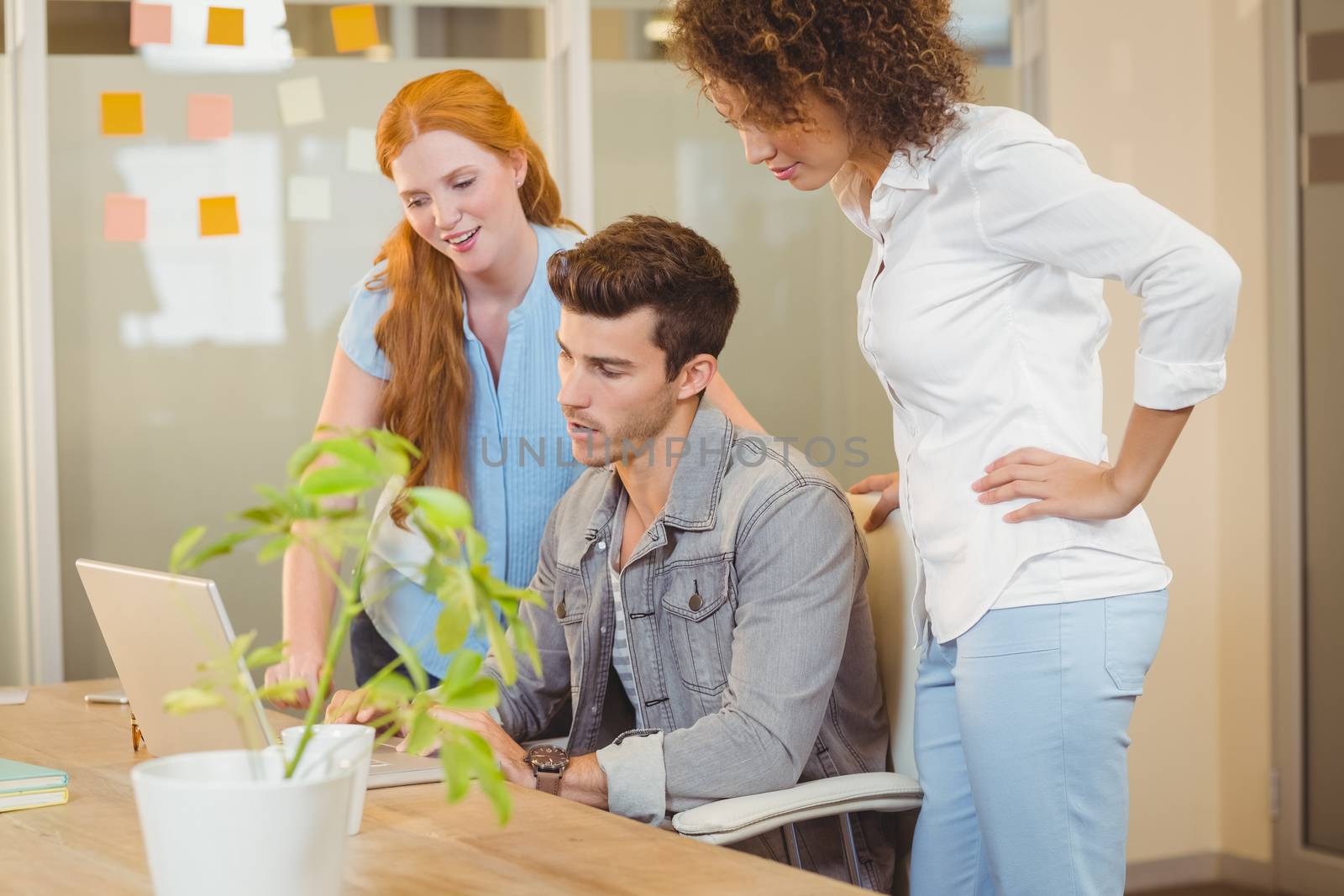 Business people with laptop at work in office