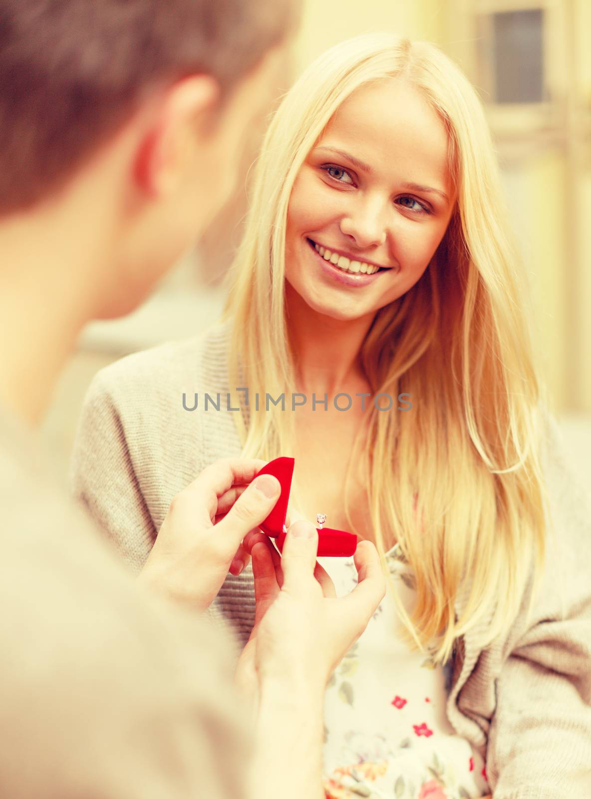 summer holidays, love, travel, relationship and dating concept - romantic man proposing to beautiful woman