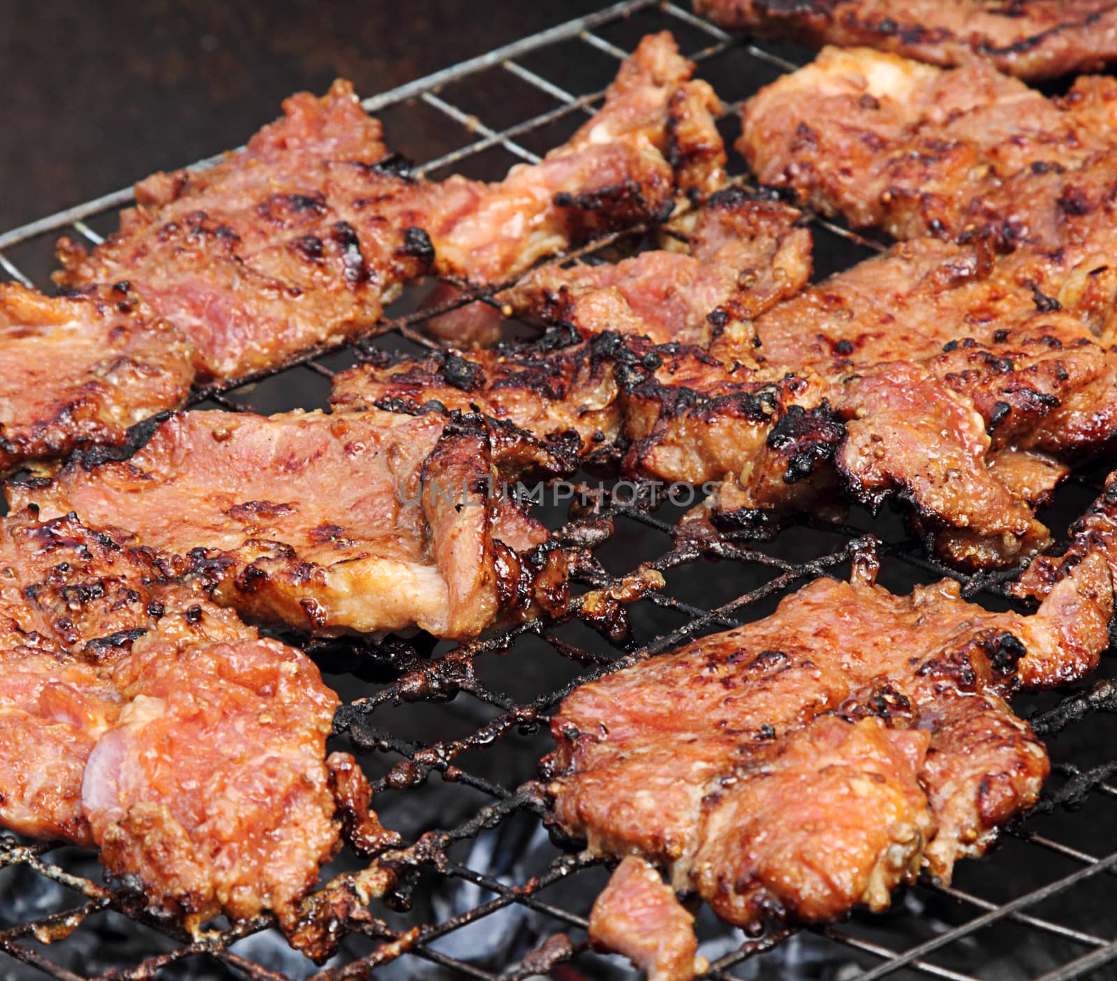 Grilled barbecue pork on the grill