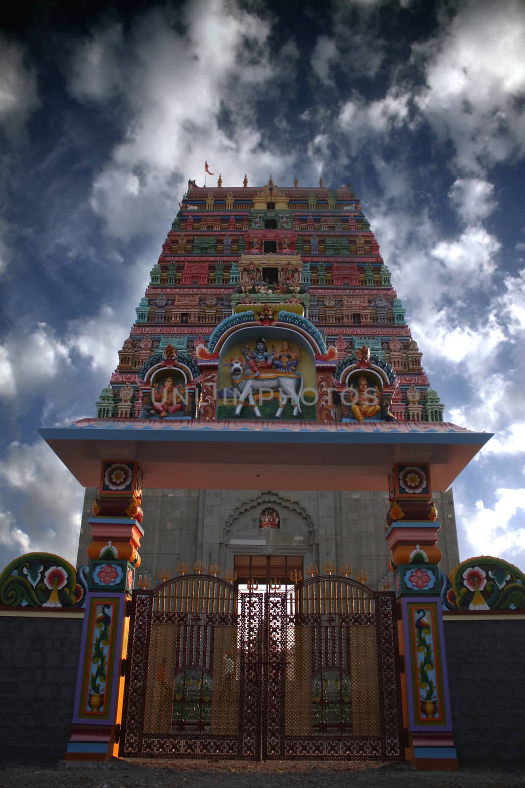 An ancient Indian temple gate with south Indian traditional architectured newly colored.