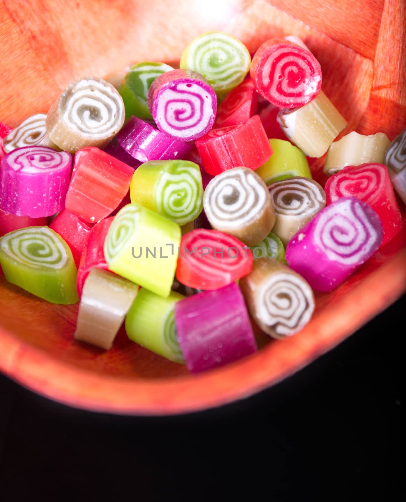 Colorful candies on black background