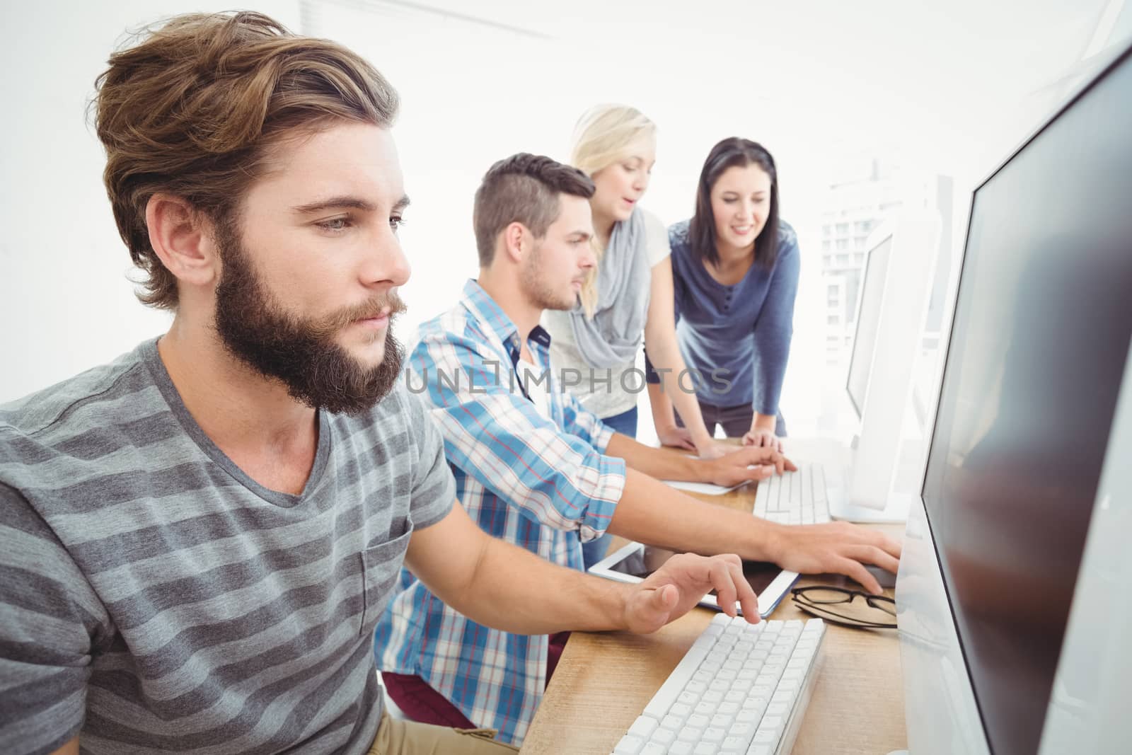 Business team working at computer desk in office