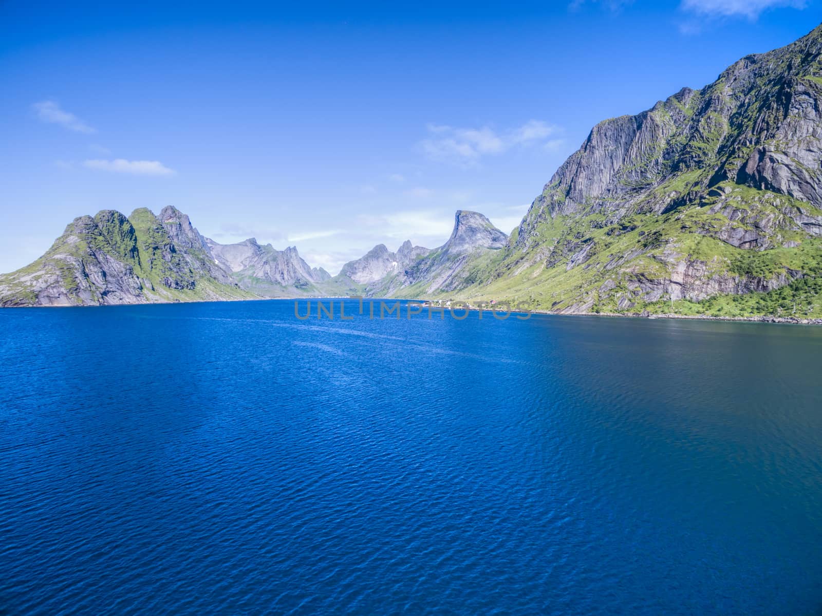 Fjord surrounded by high peaks on Lofoten islands in Norway