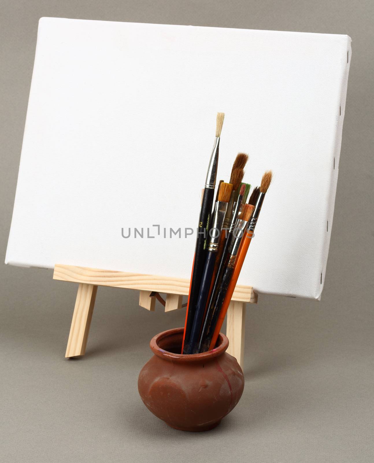 brushes and easel by alexkosev