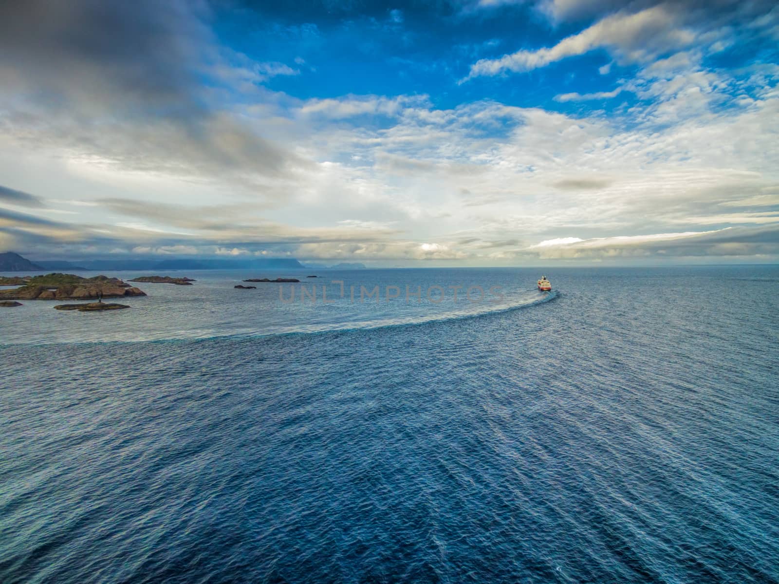 Aerial view of Hurtigruten leaving port on Lofoten islands