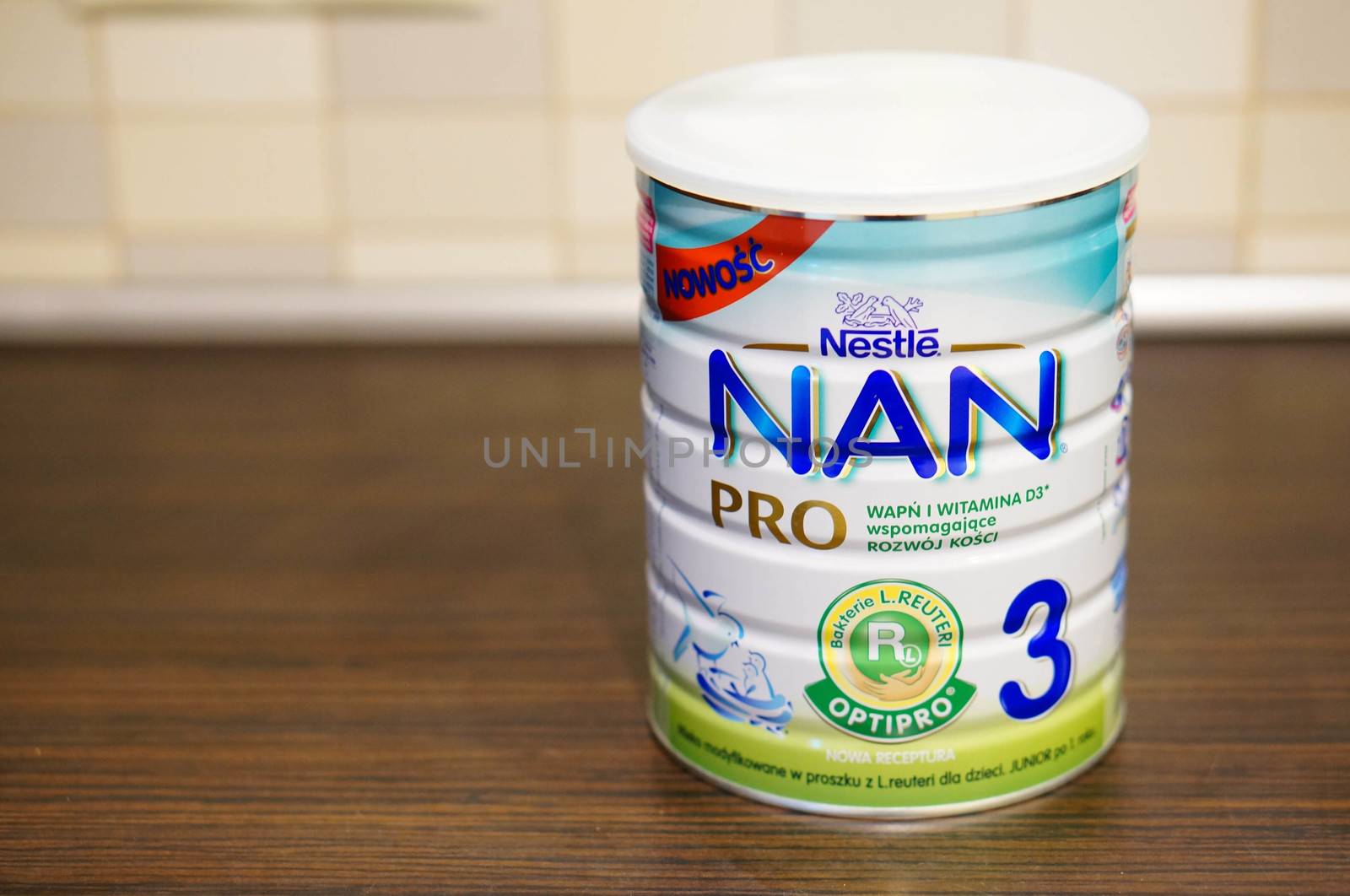 POZNAN, POLAND - SEPTEMBER 24, 2015: Nan Pro 3 baby milk powder in a container