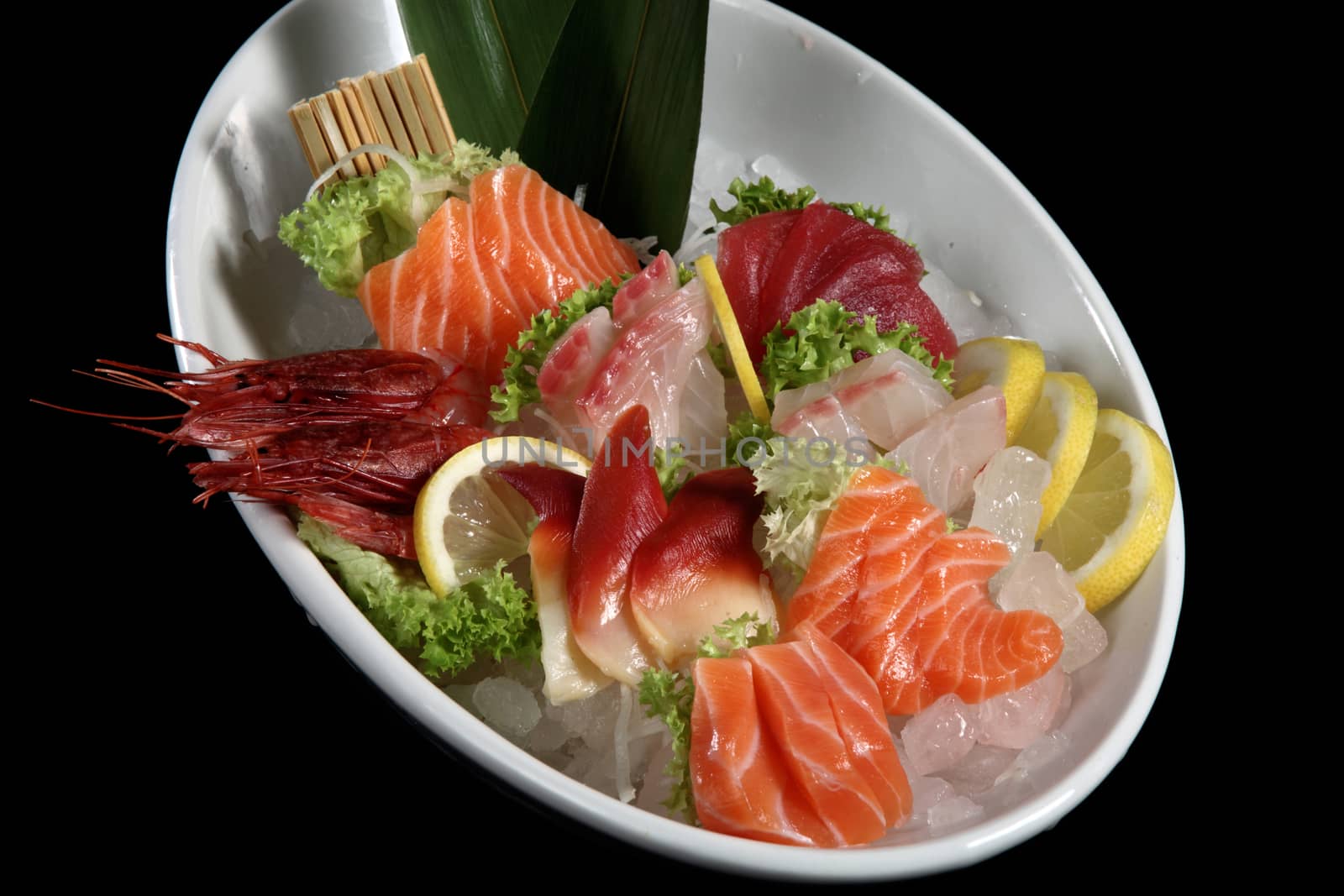 close up sashimi plate by diecidodici