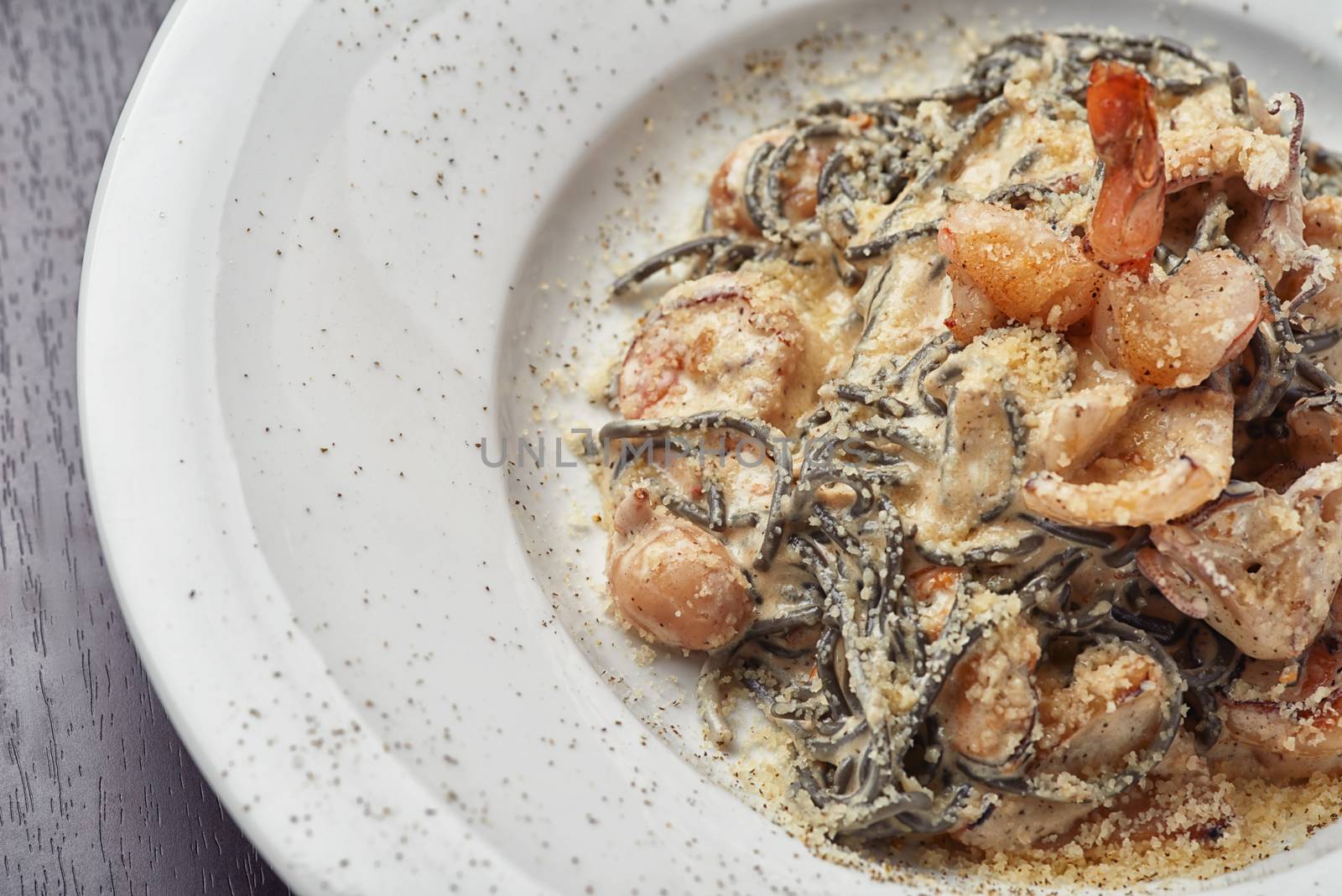 Italian black spaghetti with scallops, shrimp and octopus by shivanetua