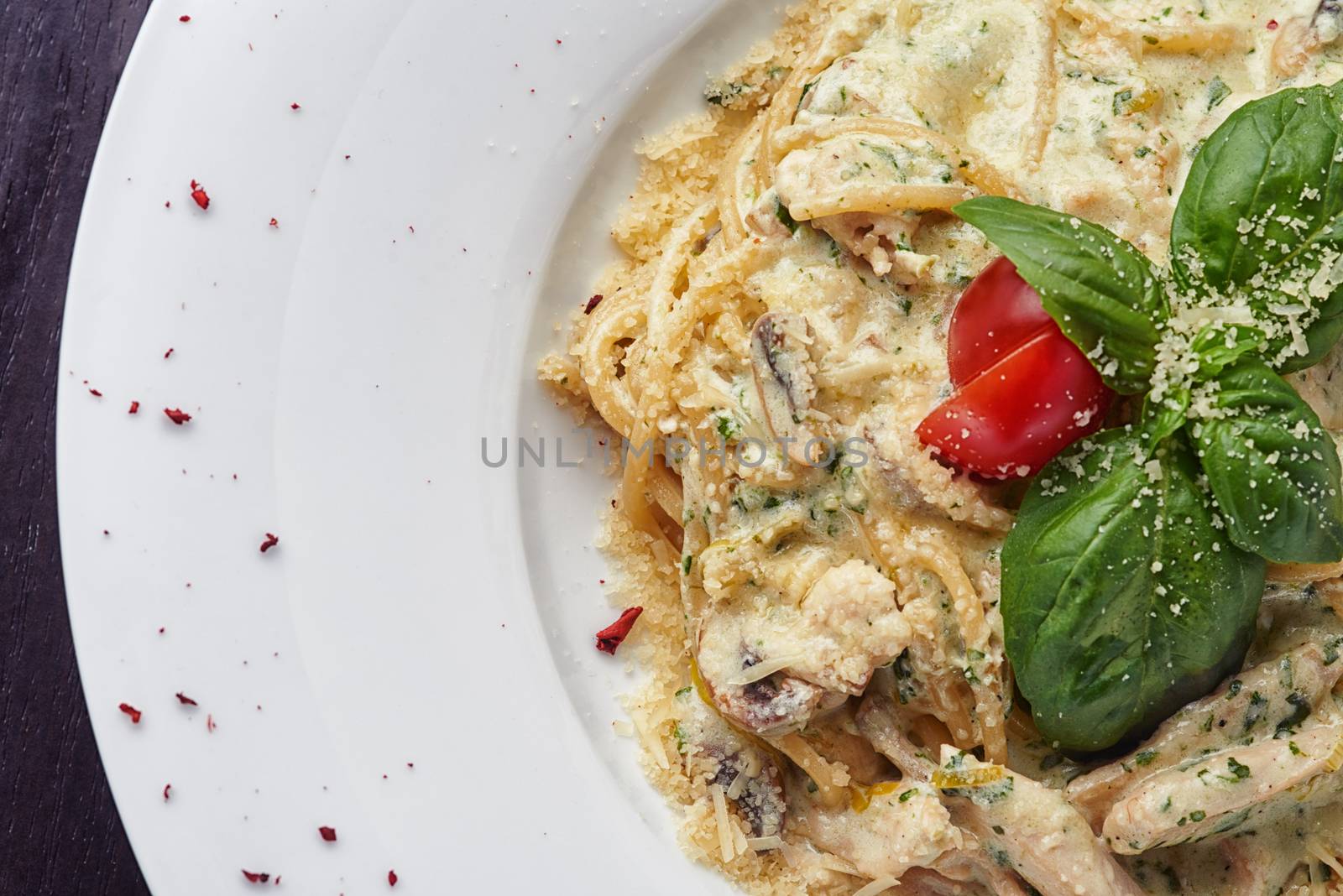 Italian spaghetti with sauce, mushrooms and basil leaf by shivanetua