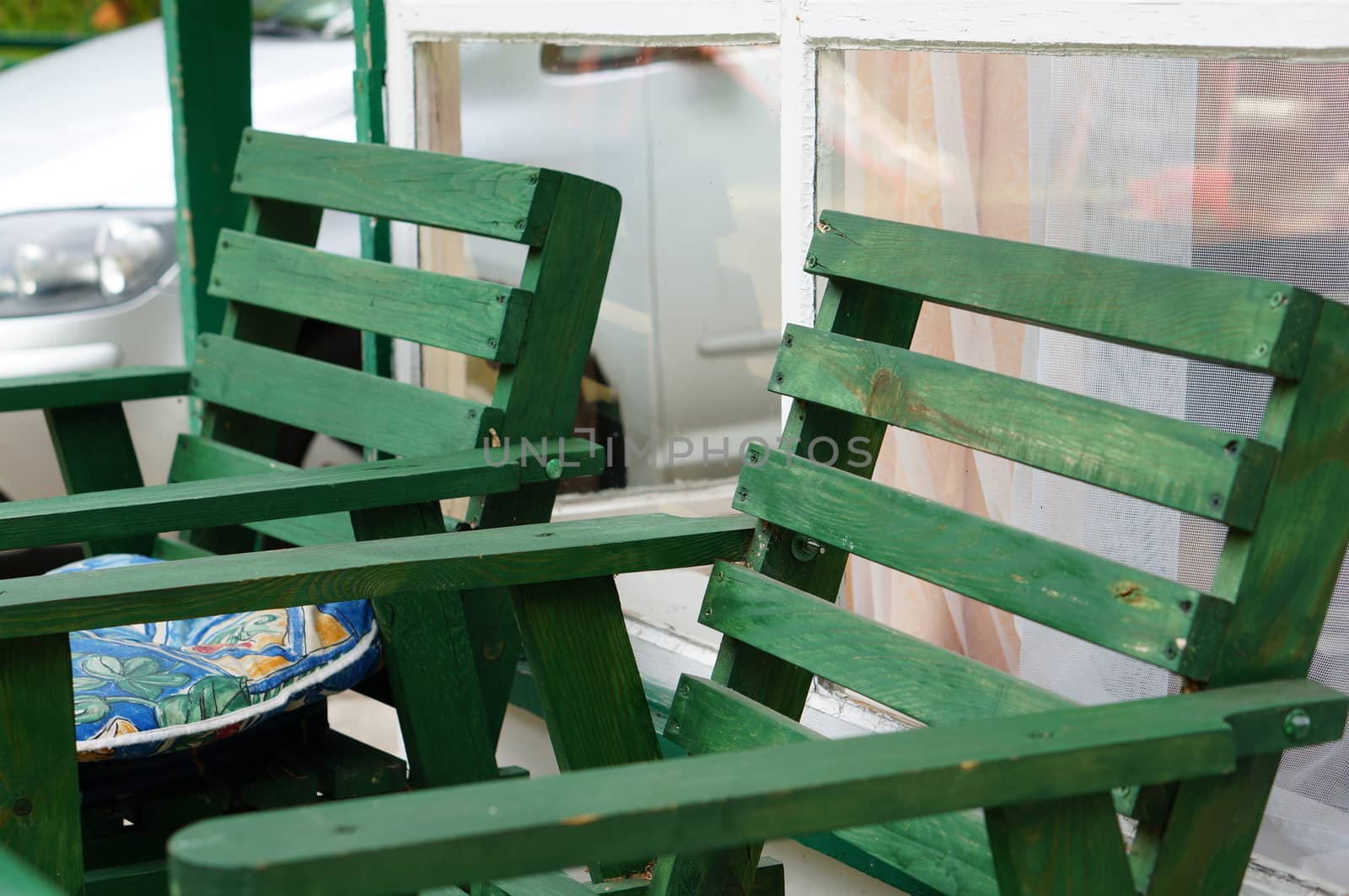 Close up of two wooden garden chairs