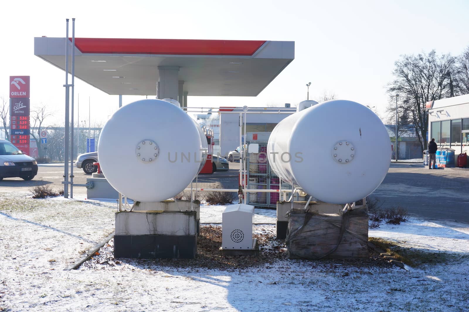 POZNAN, POLAND - JANUARY 25, 2014: Two oil tanks at a Orlen filling station on a cold winter day