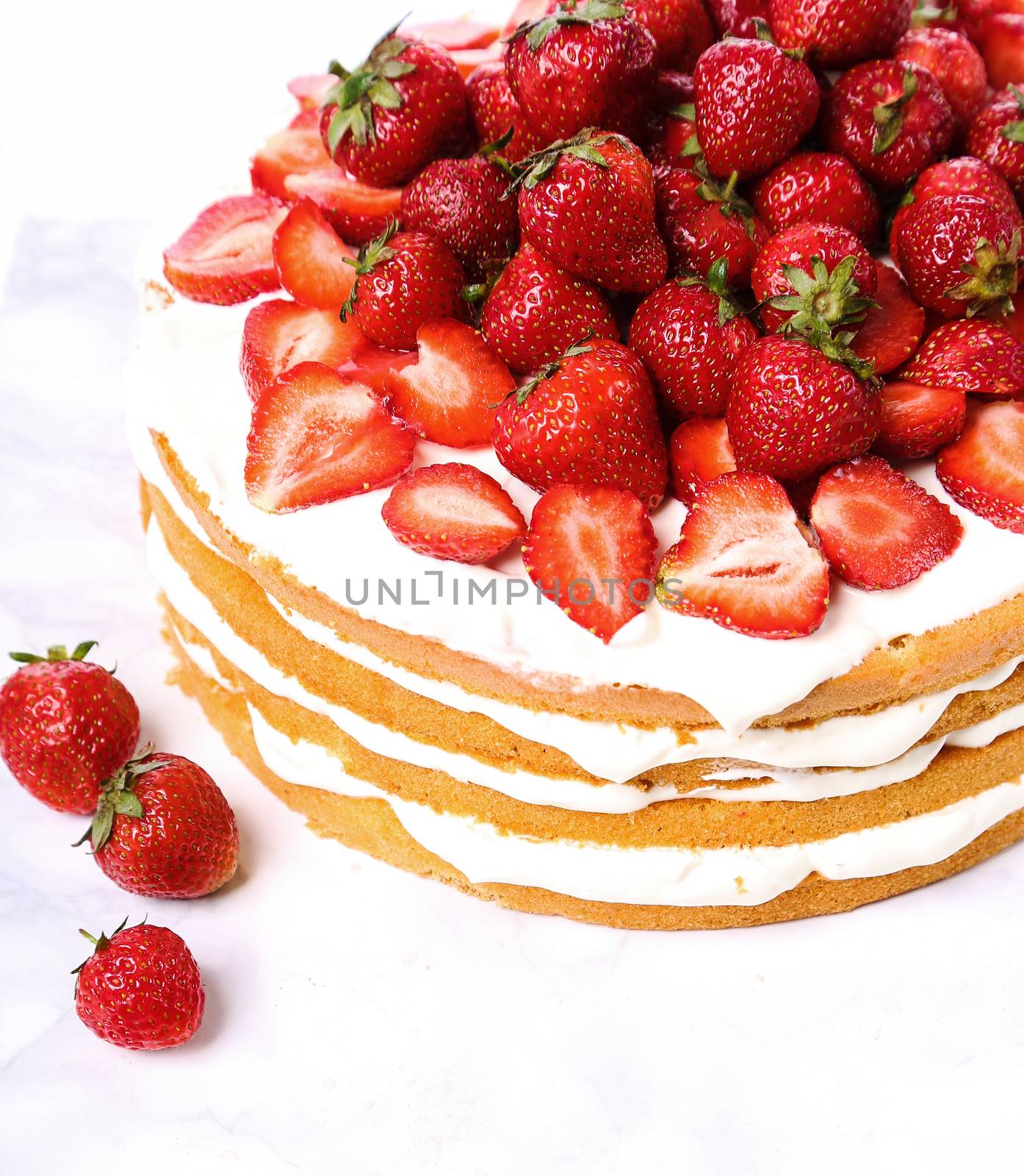 Layered, strawberry cake on the table