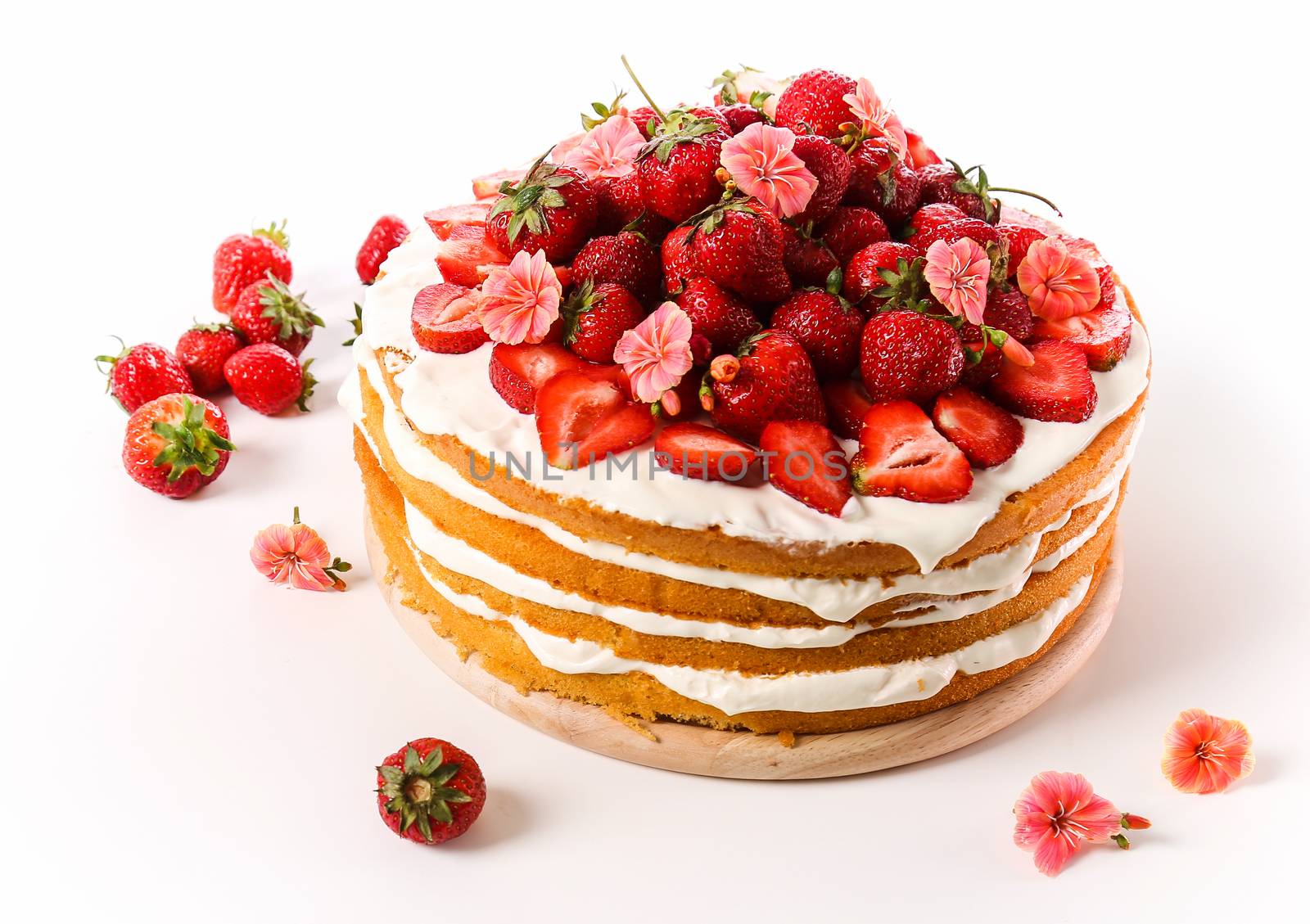 Layered, strawberry cake on the table