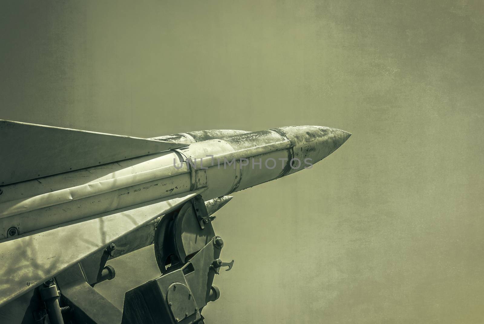Old russian antiaircraft defense rocket launcher missiles. Grunge Army Missile.  Photo textured in old color image style.