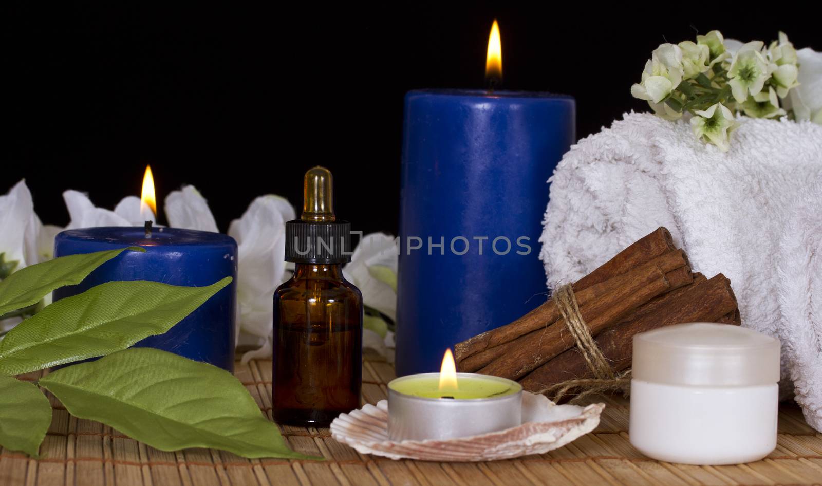 Bottle with spa essence,spa candles,flowers and cream by Irina1977