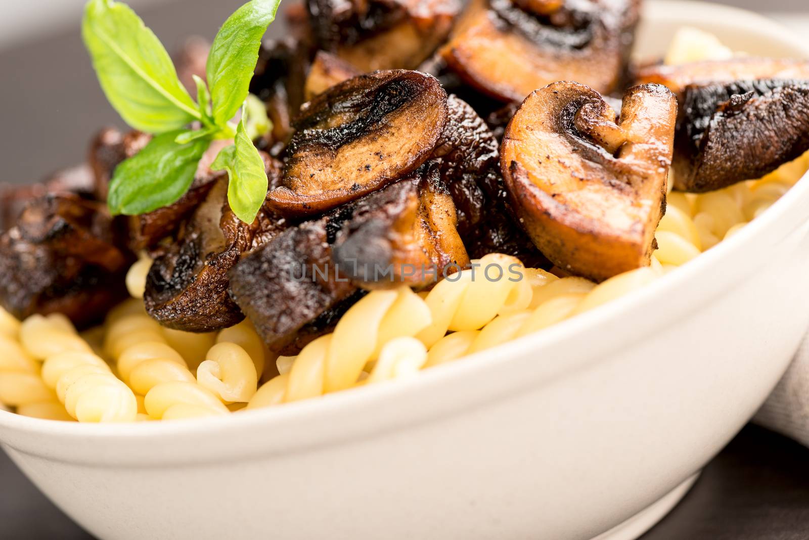 Fusilli with mushrooms, italian cuisine