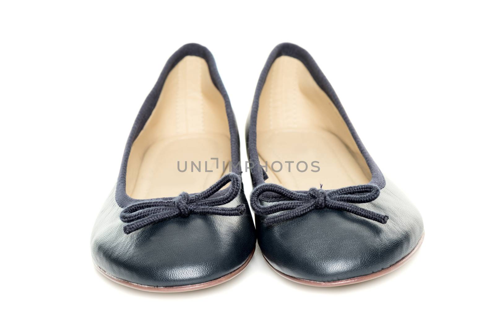 Pair of female shoes over white background