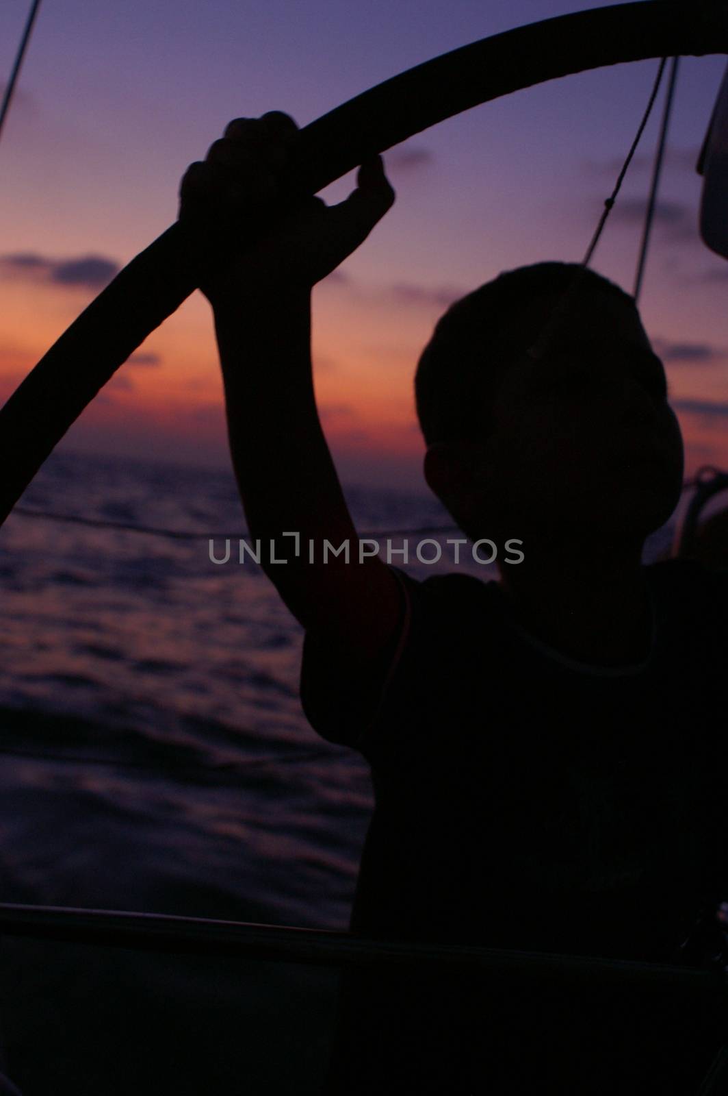 a child  silhouette on a yacht by javax